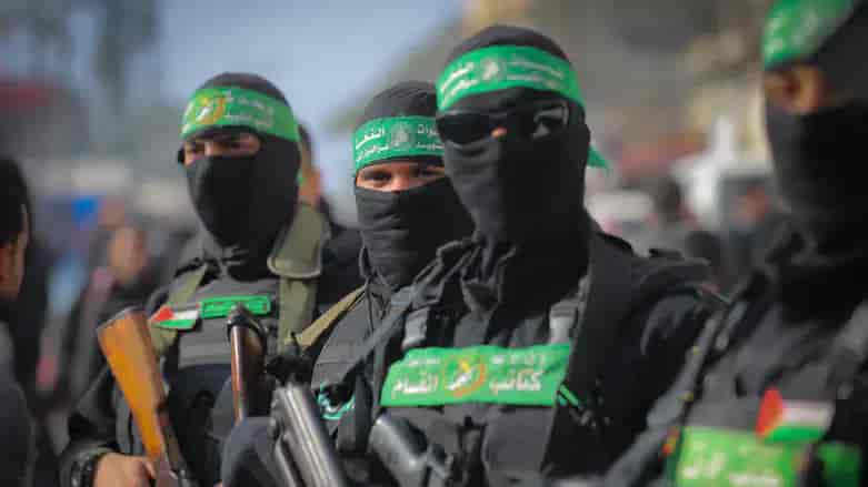 Hamas militants in Gaza background
