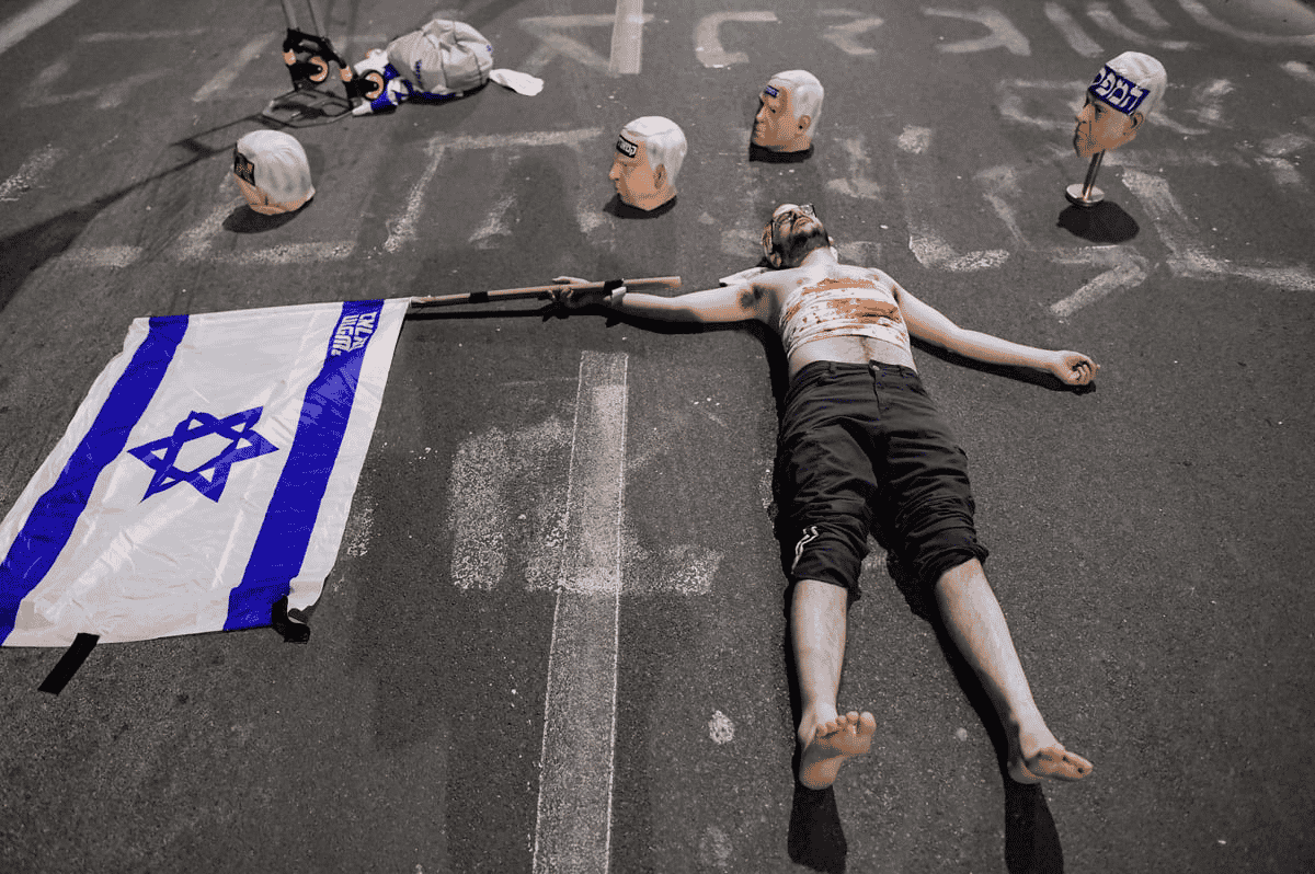 Severed-heads demonstation in Tel Aviv background