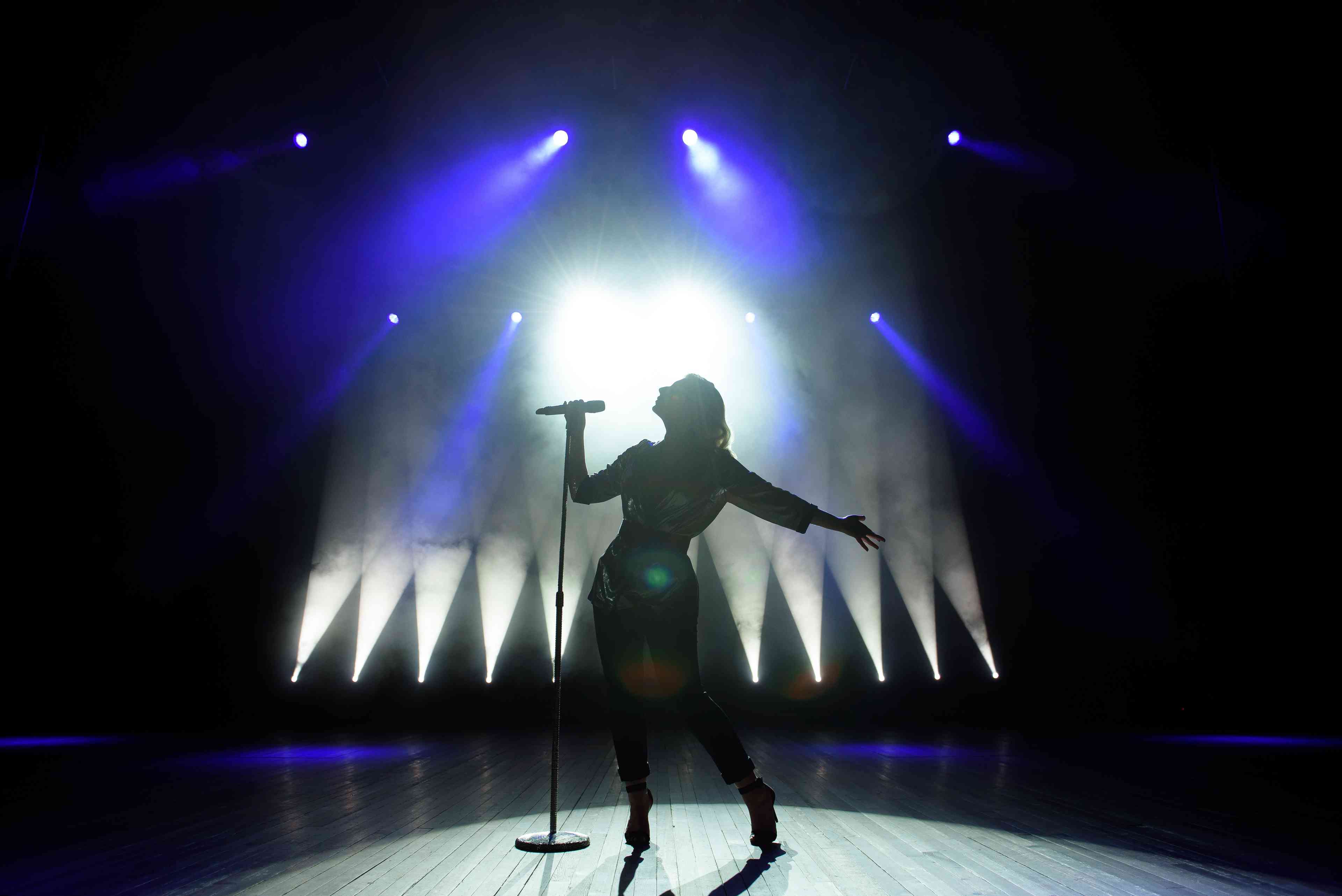 Silhouette of female singer background