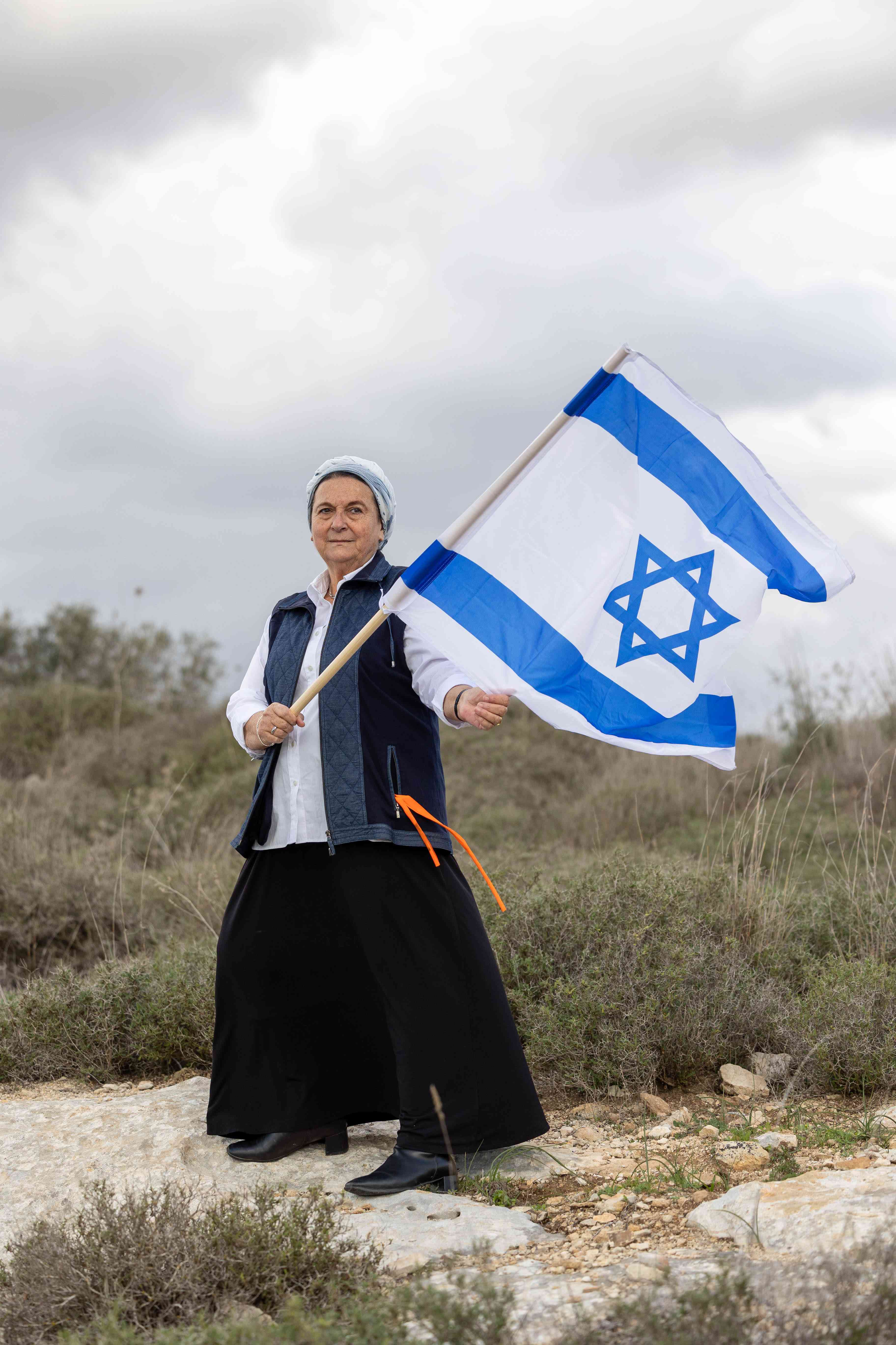 Portrait of Daniella Weiss in her home in the Israeli settlement of Kedumim. December 29, 2024. background