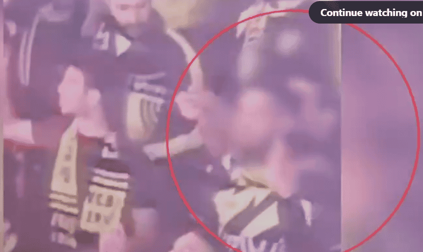 Soccer fan firing fireworks into the crowd background