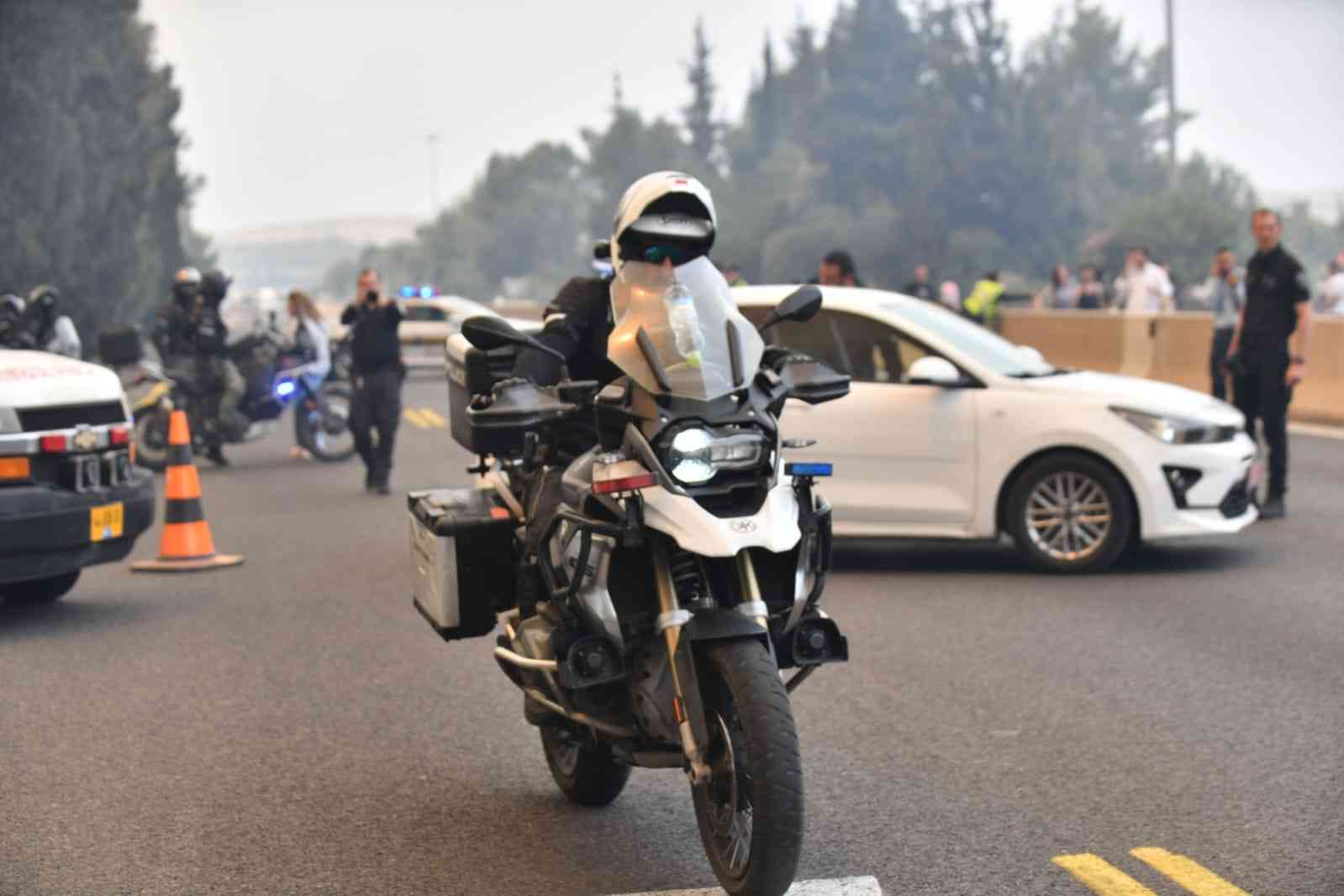Police evacuating civilians from the fire background