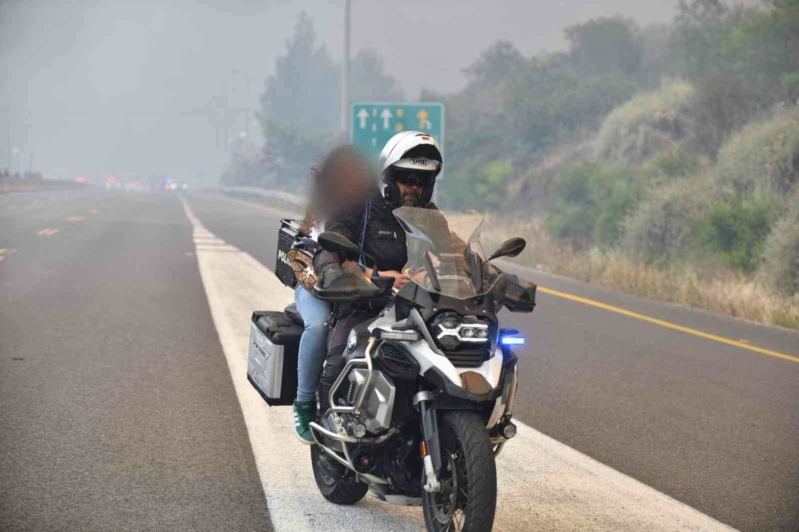 Police evacuating civilians from the fire background