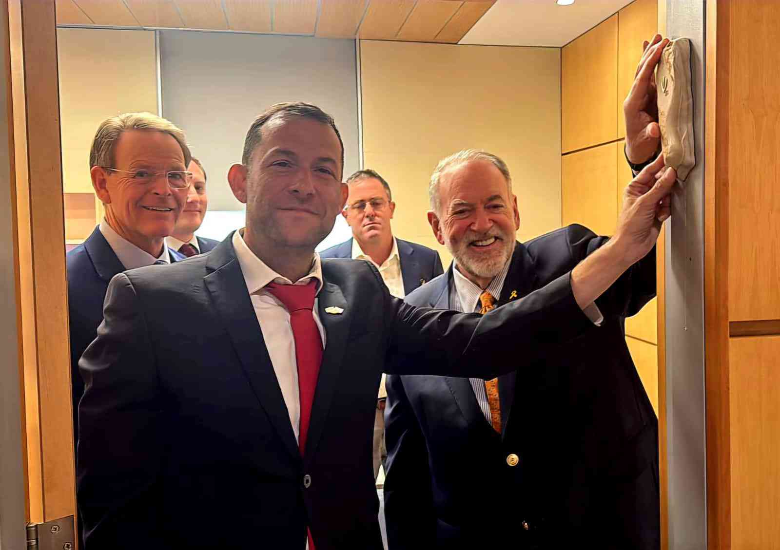 US Ambassador Huckabee and Yossi Dagan affix Samaria Mezuzah background