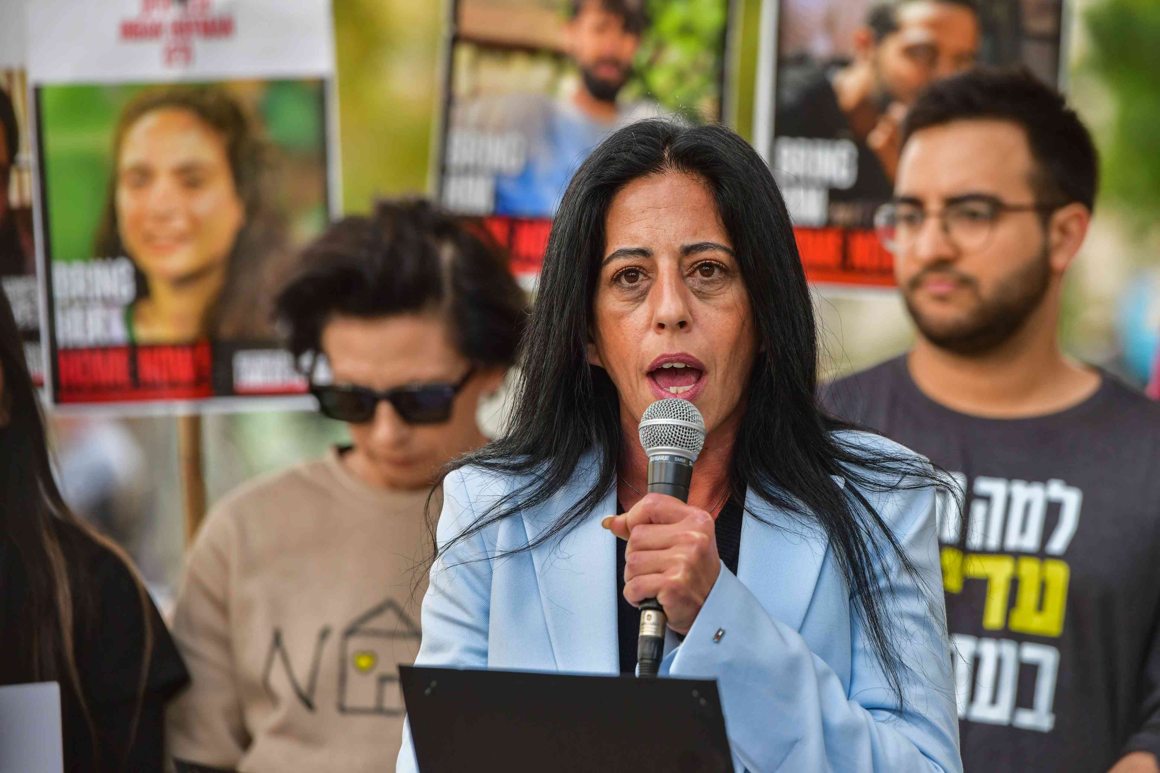 Einav Tsengaoker, the mother of hostage Matan Tsengaoker speaks during a press conference in Tel Aviv on March 29, 2025. background