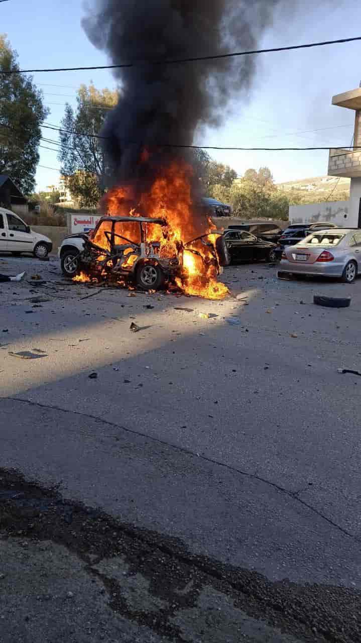 Destruction of Hezbollah vehicle. background