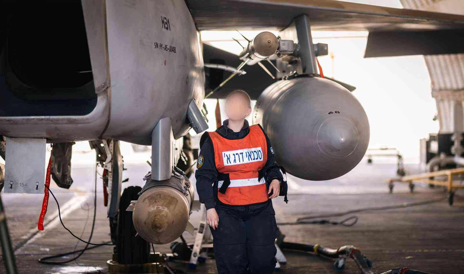 Technician standing near bomb. background