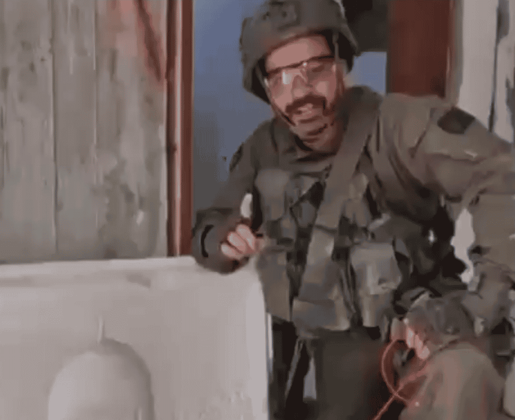 IDF soldier near image of al-Aqsa. background