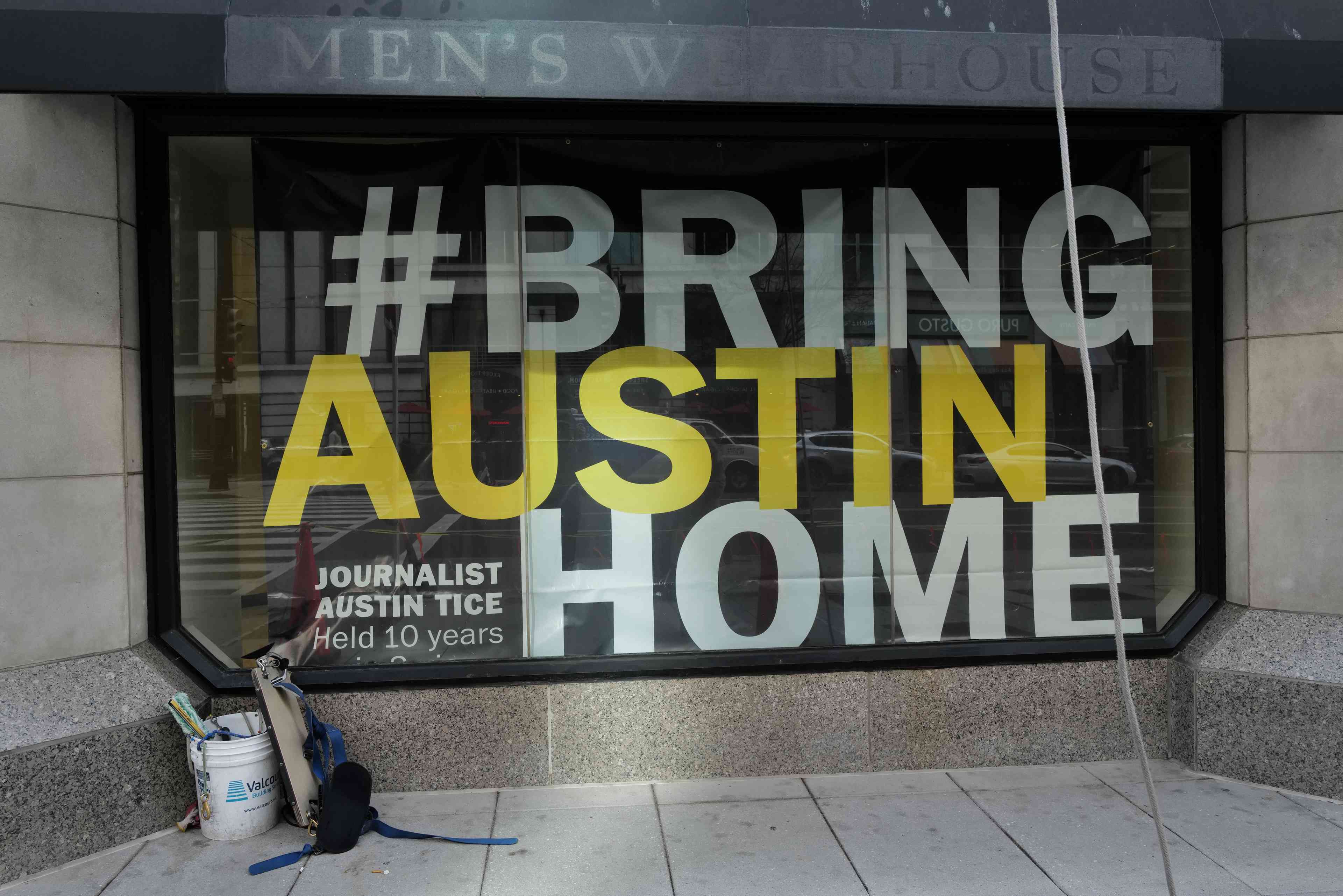 A sign at the National Press Club calling for the release of journalist Austin Tice held captive in Syria since 2012 background