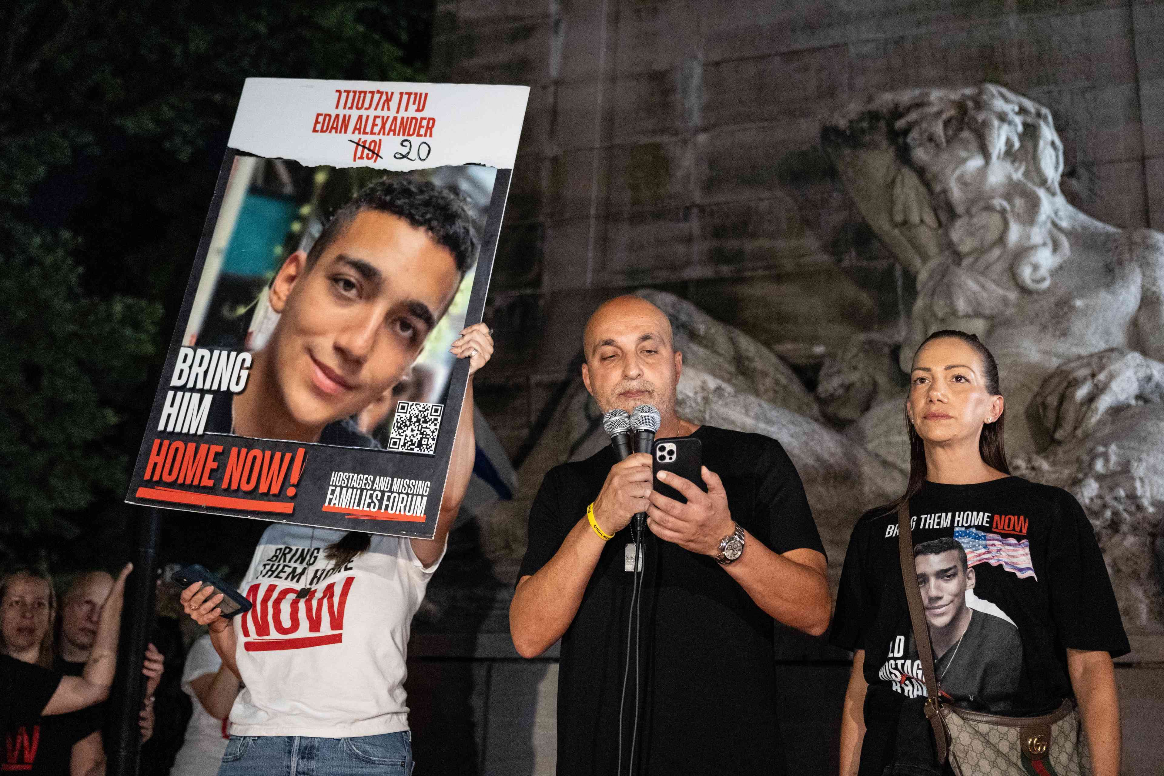 Adi Alexander speaks with Yael at his side, parents of Edan Alexander background