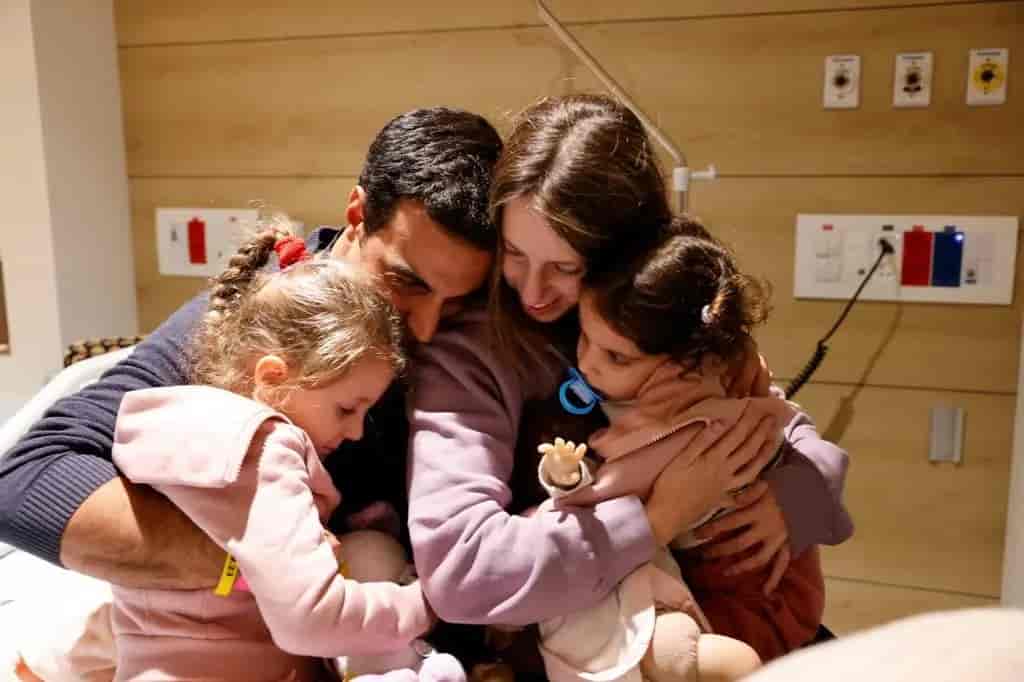 Doron Katz-Asher and her family after being freed from captivity  background