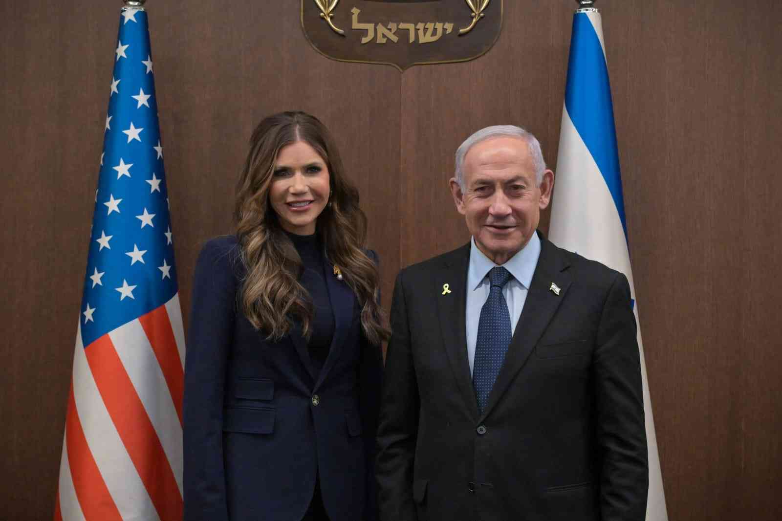 Prime Minister Netanyahu and Kristi Noem. background