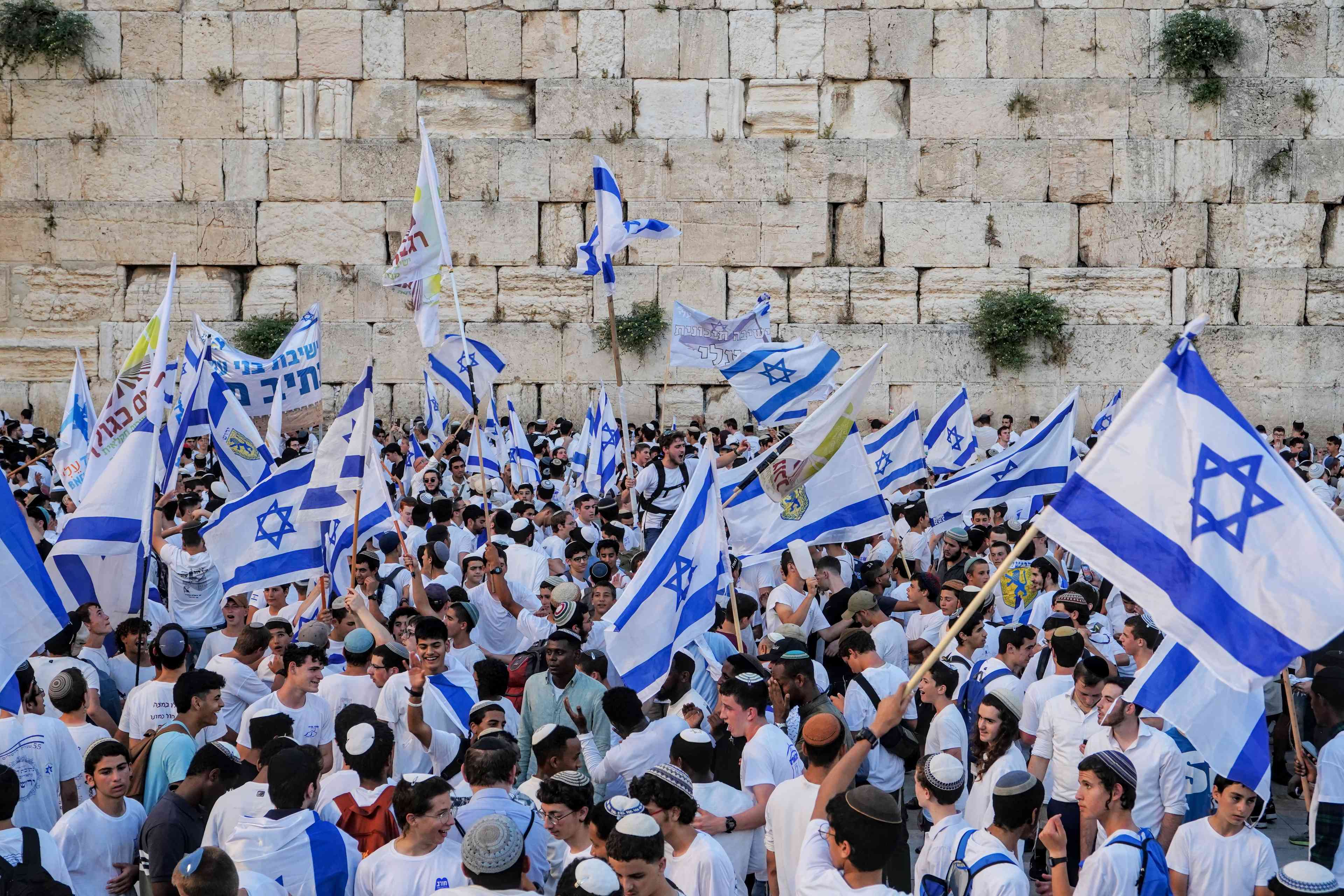 Jerusalem Day celebrations near the Western Wall in the Old City of Jerusalem background