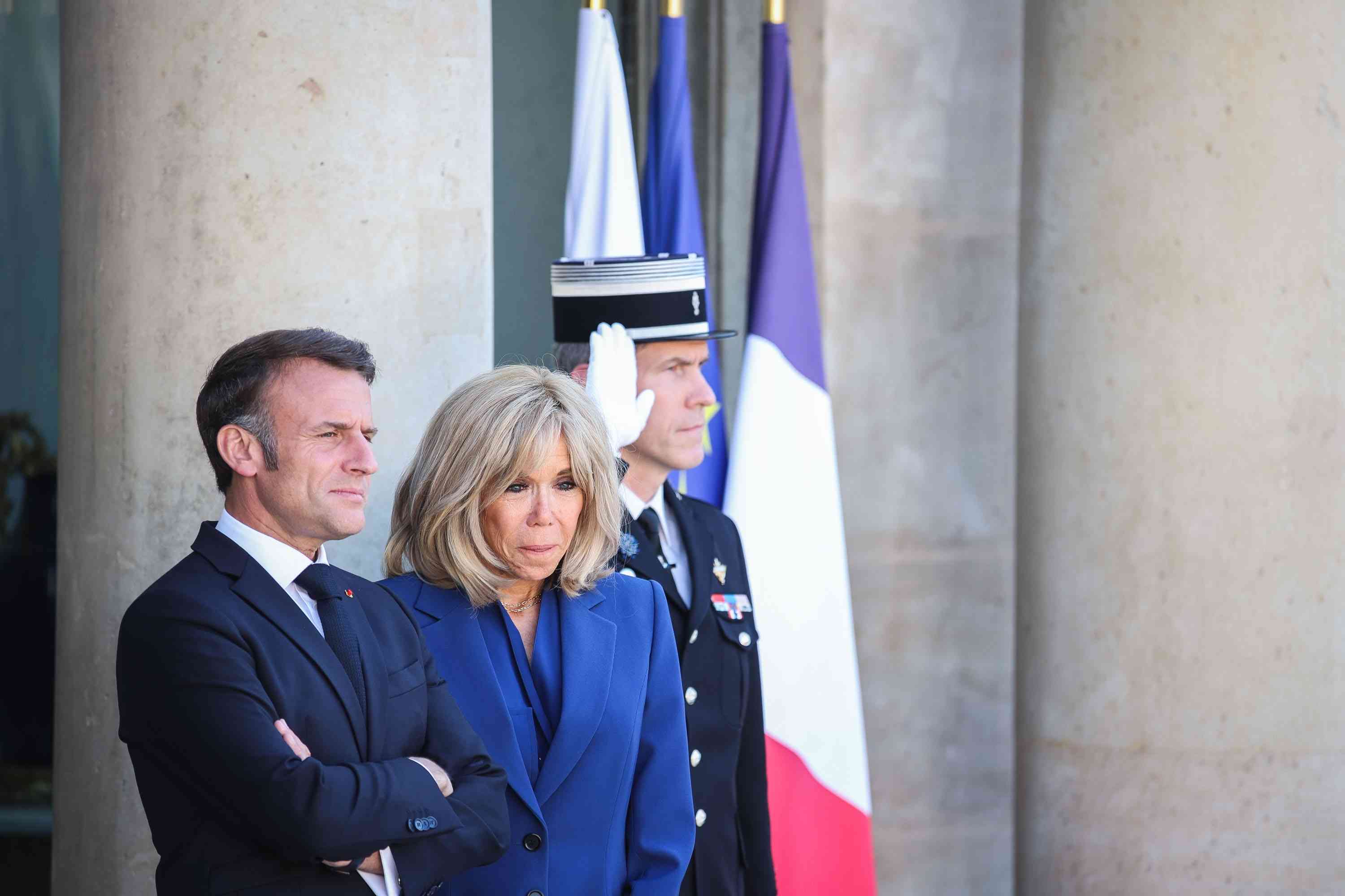 Emmanuel Macron and his wife Brigitte background
