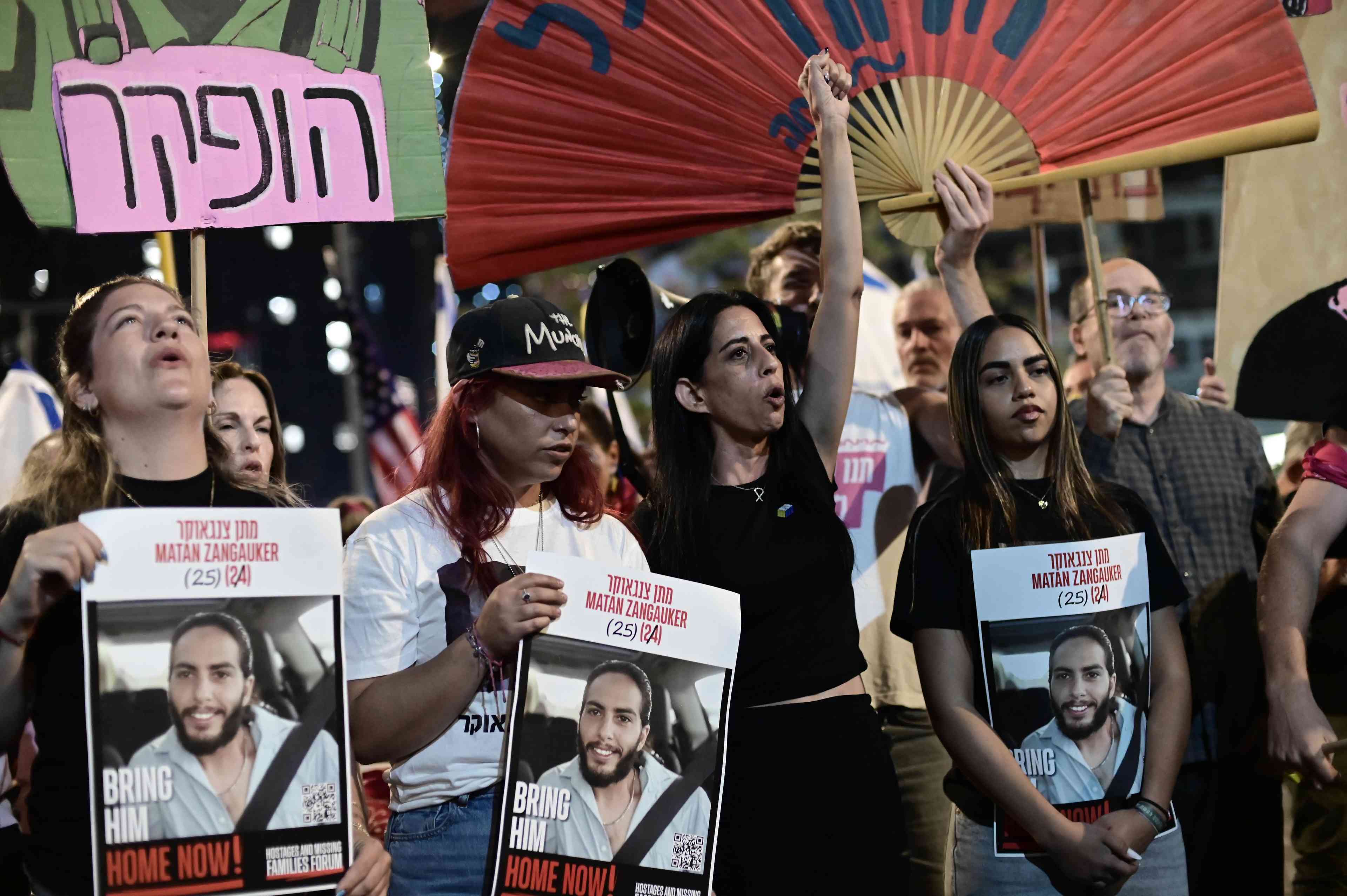 Demonstrators protest against the Israeli government and for the release of Israelis held hostage in the Gaza Strip outside Hakirya Base in Tel Aviv, May 24, 2025. background