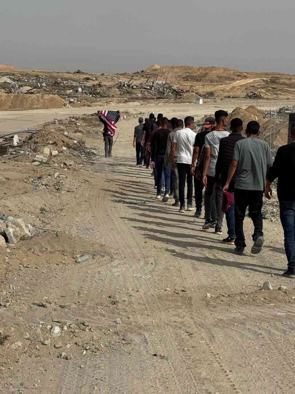 A Gazan waving the US flag, Rafah, May 27th, 2025 background