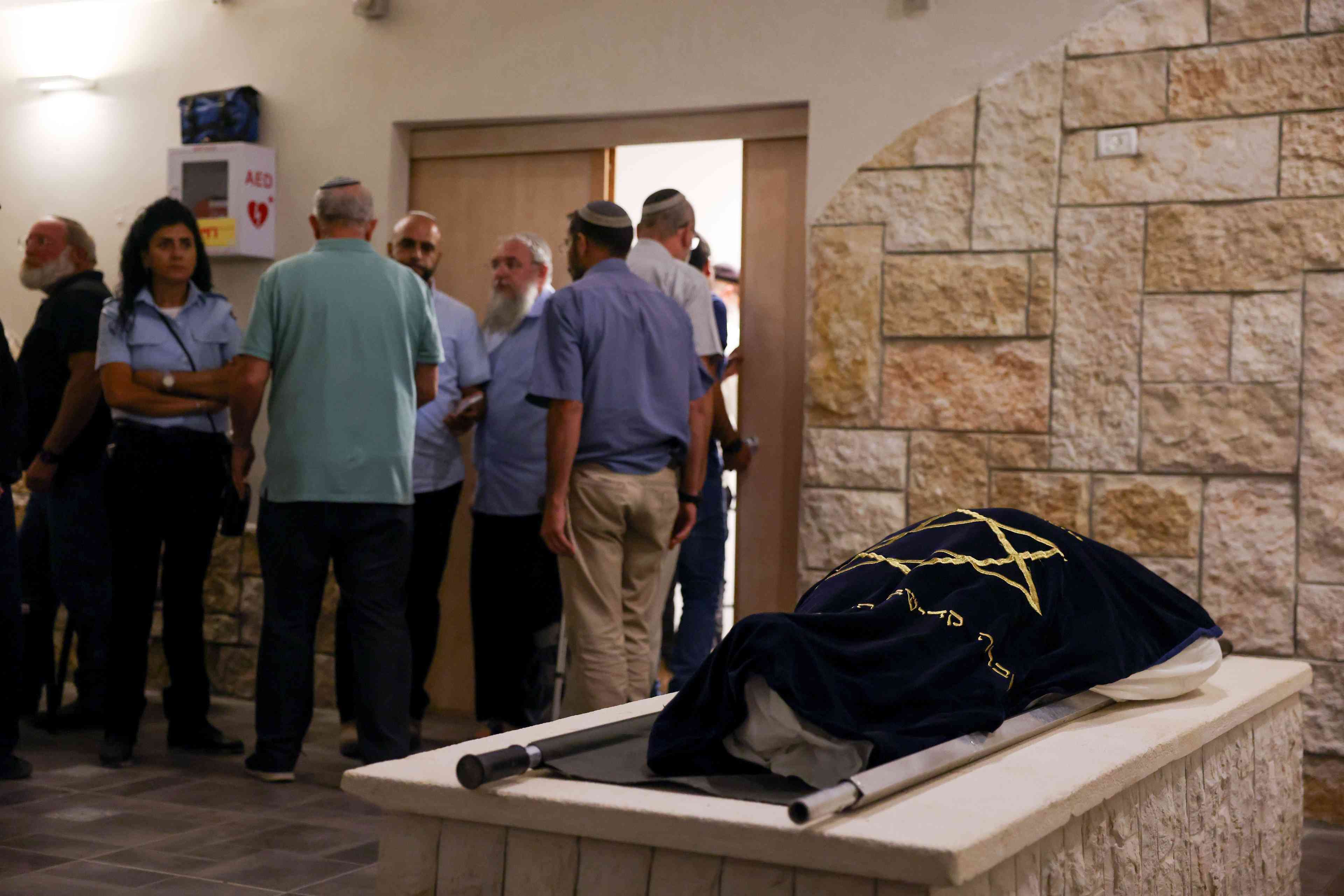 Family and friends attend the funeral of Batsheva Nigri who was murdered in a terrorist shooting attack near Hebron earlier today at the Gush Etzion Regional Cemetery in Kfar Etzion on August 21, 2023.  background