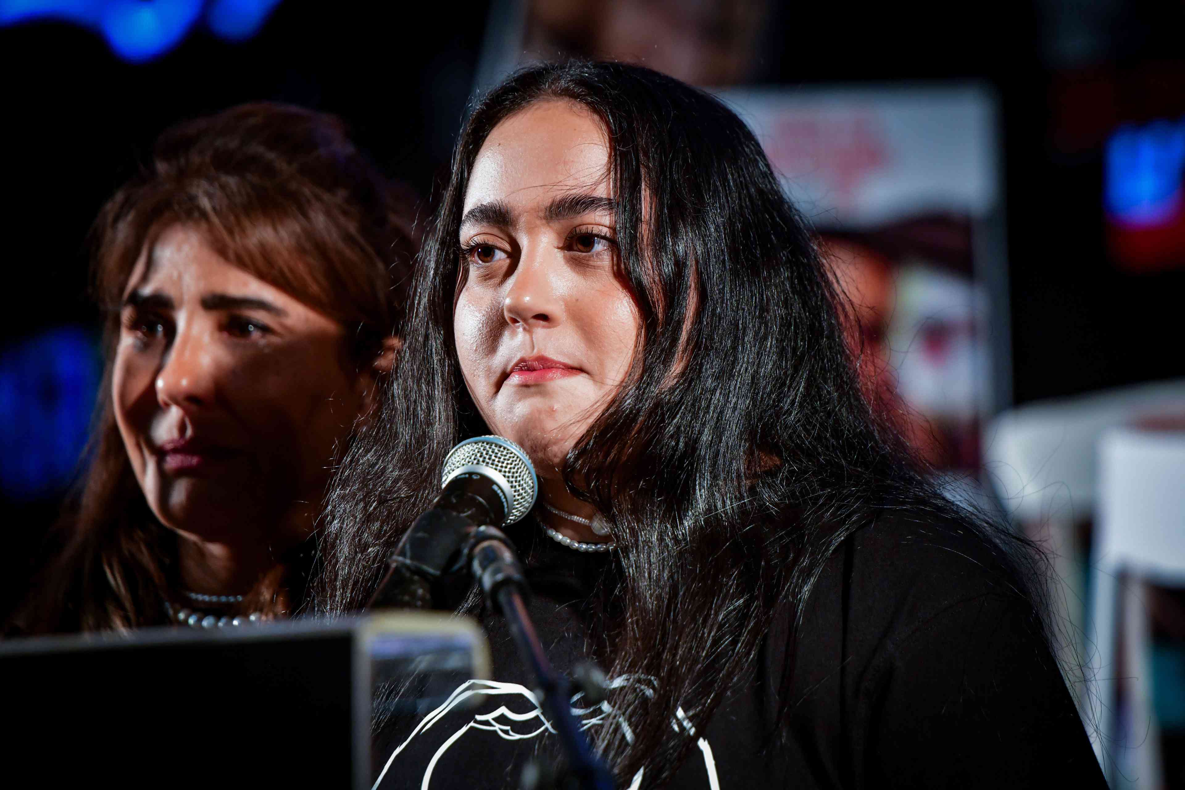 Former hostage Liri Albag speaks during a rally calling for the release of Israelis held hostage by Hamas terrorists in Gaza, at "Hostage Square" in Tel Aviv, April 5, 2025. background