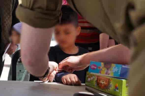 IDF treating civilians in Syria background