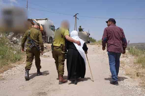 IDF treating civilians in Syria background
