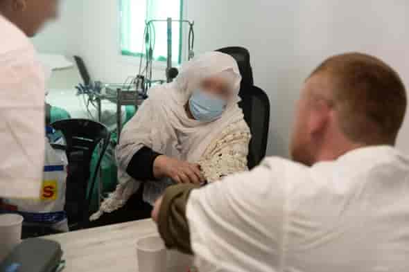 IDF treating civilians in Syria background