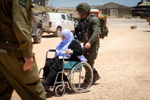 IDF treating civilians in Syria background