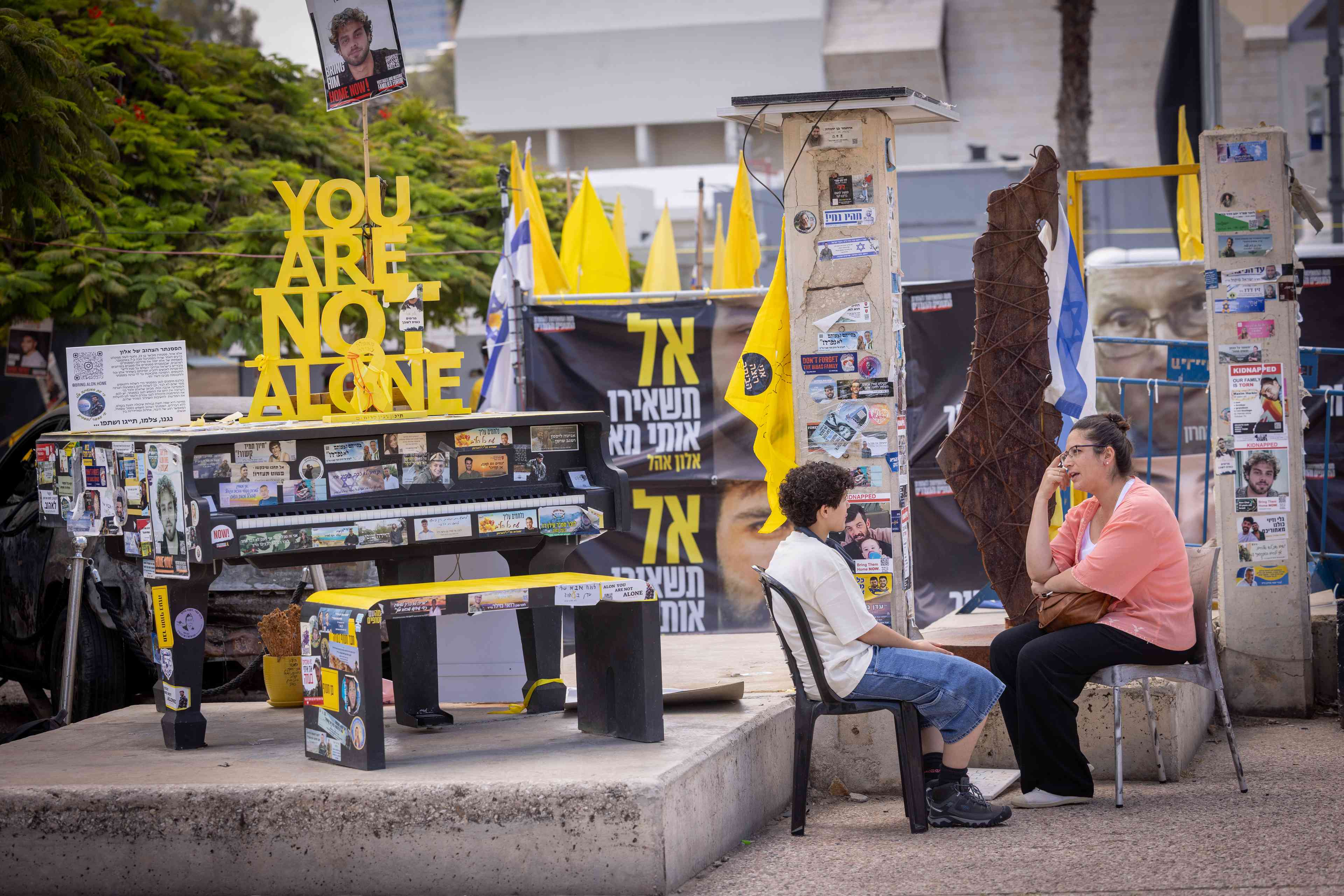 Visitors at Hostage Square in Tel Aviv on May 28, 2025.  background