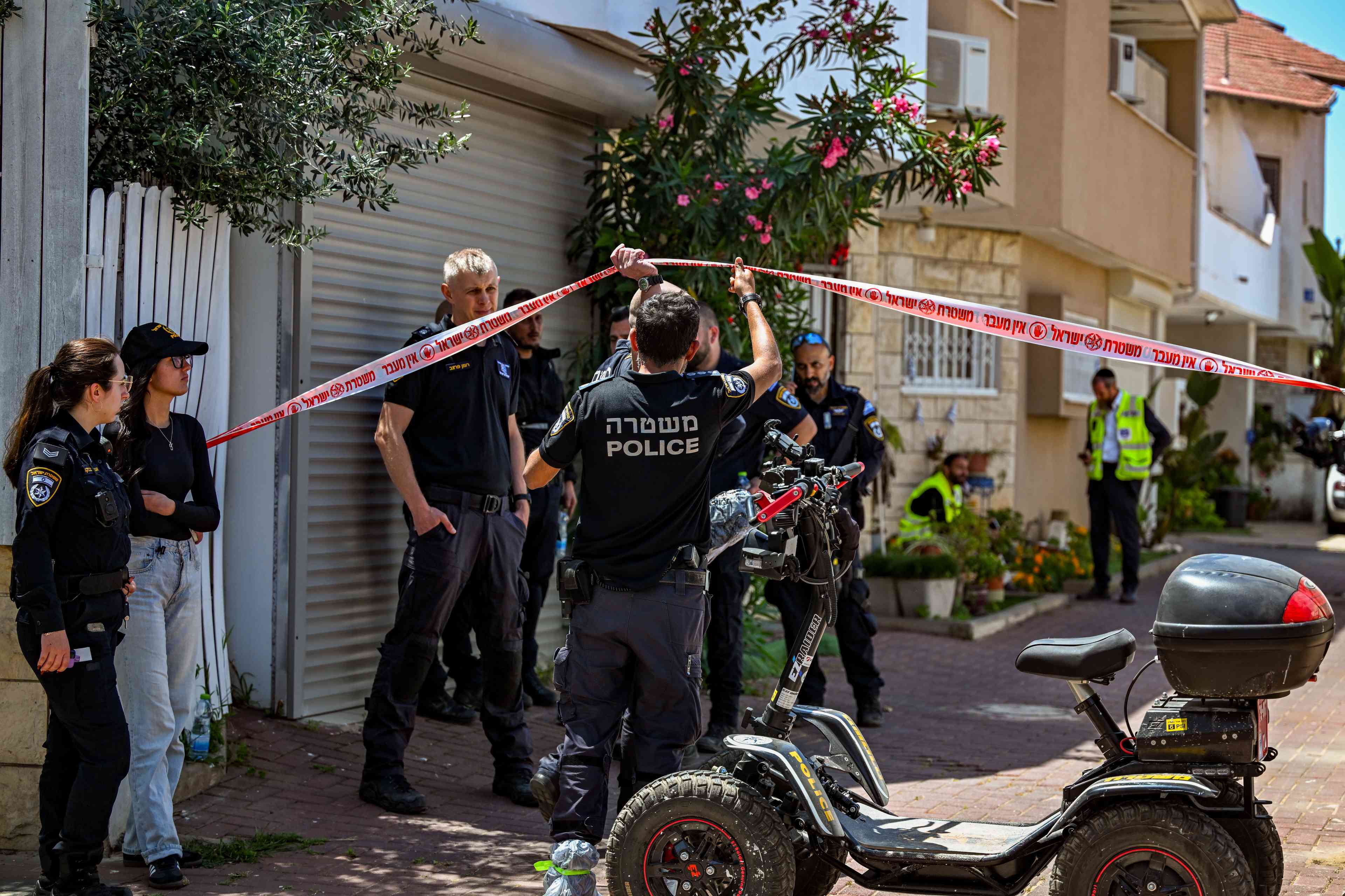 Police at the scene where a woman found buried in yard of house. background