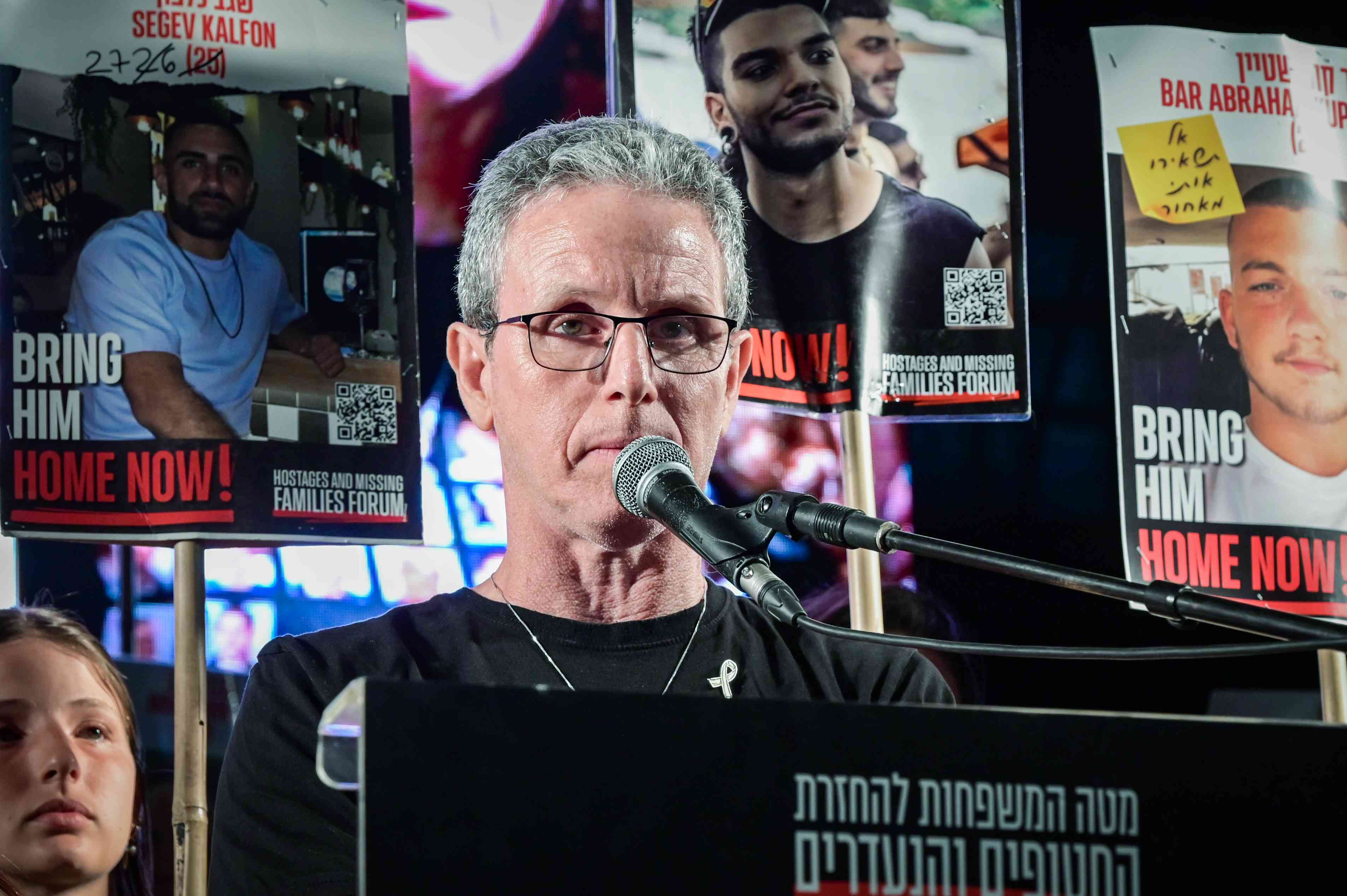 Former hostage Ohad Ben Ami speaks during a rally calling for the release of Israelis held hostage by Hamas terrorists in Gaza, at "Hostage Square" in Tel Aviv, marking 600 days of the hostages captivity, May 28, 2025. background