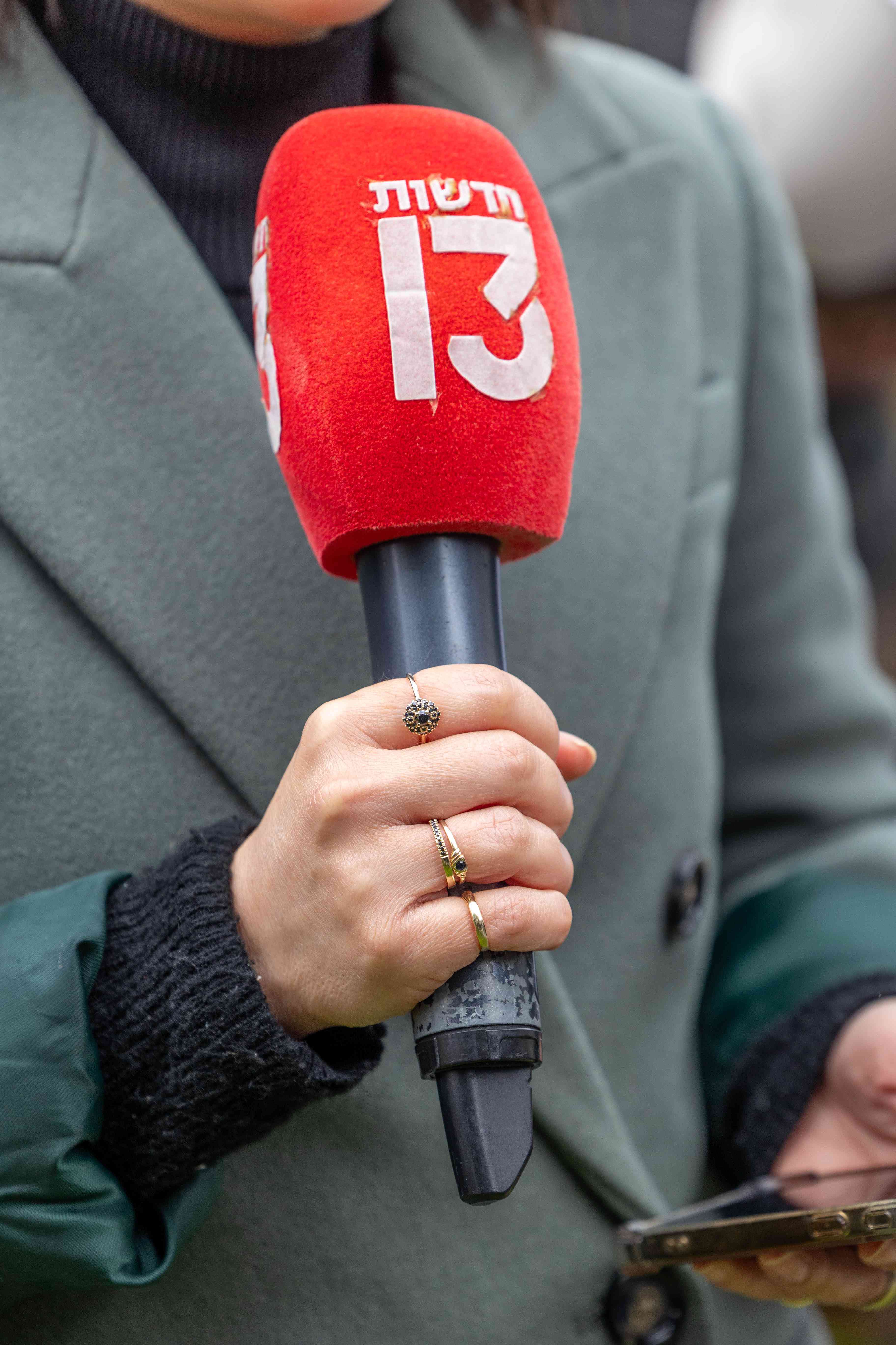 A reporter from channel 13. February 22, 2025.  background