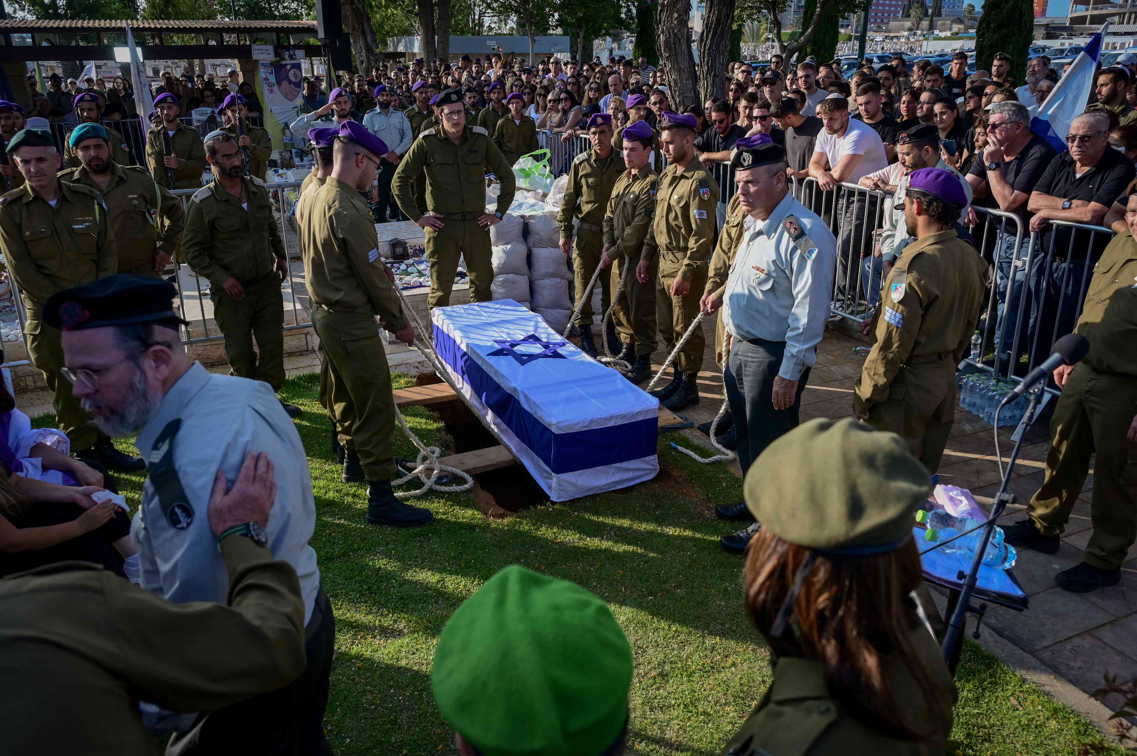 Family and friends of Israeli soldier Staff sergeant Lior Steinberg attend his funeral at the Military Cemetery in Petah Tikva on June 3, 2025. He was killed in combat in the Gaza Strip. background