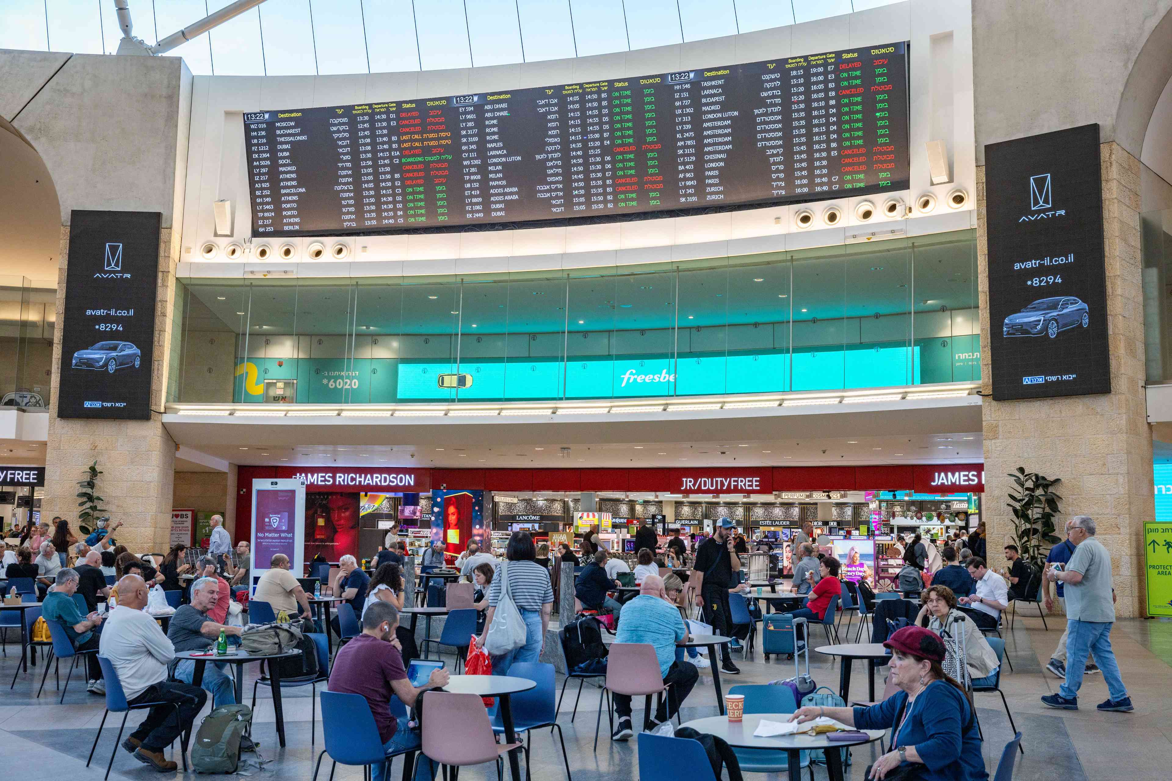 Travellers at Ben Gurion International Airport, May 13, 2025. background