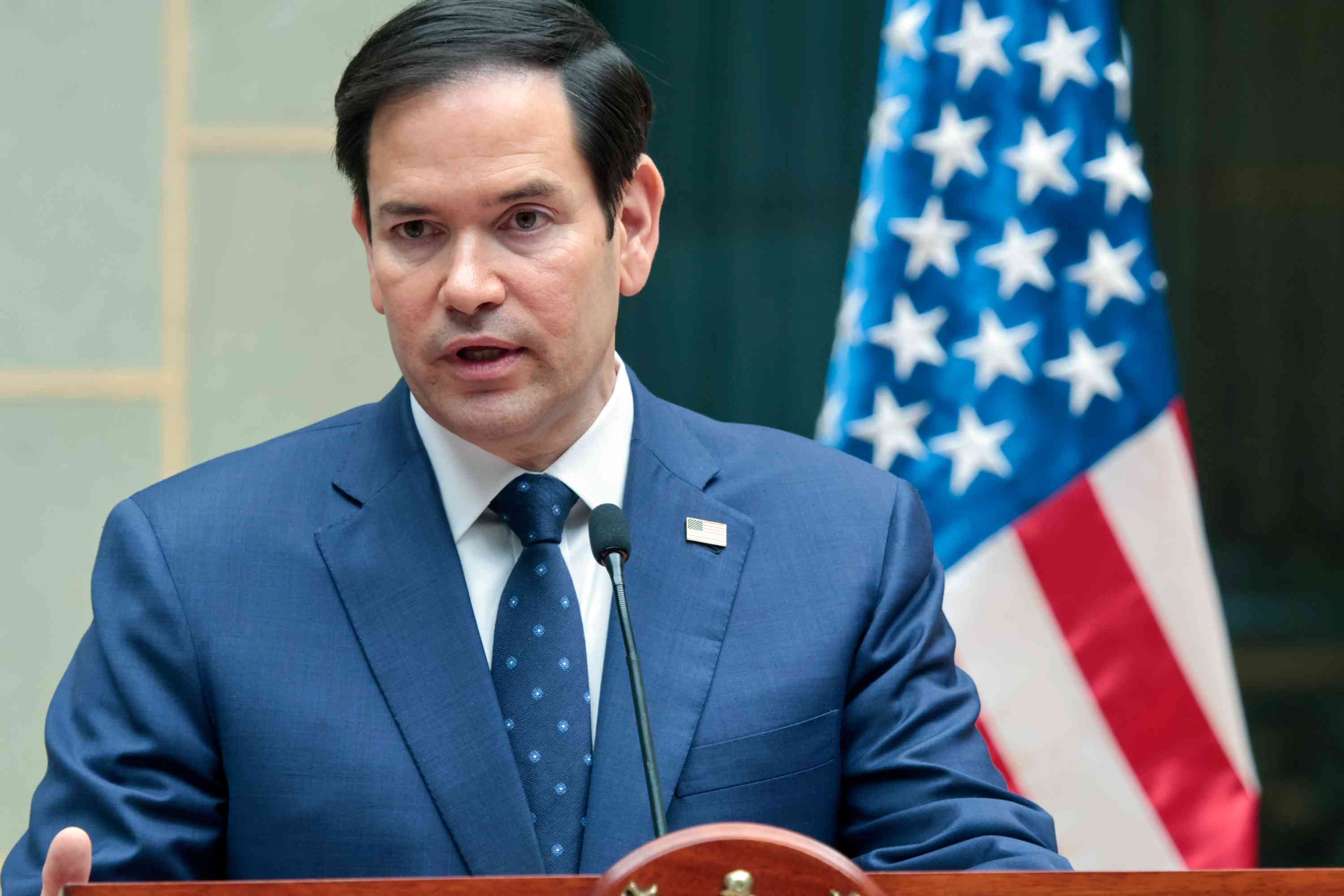 Secretary of State Marco Rubio. background
