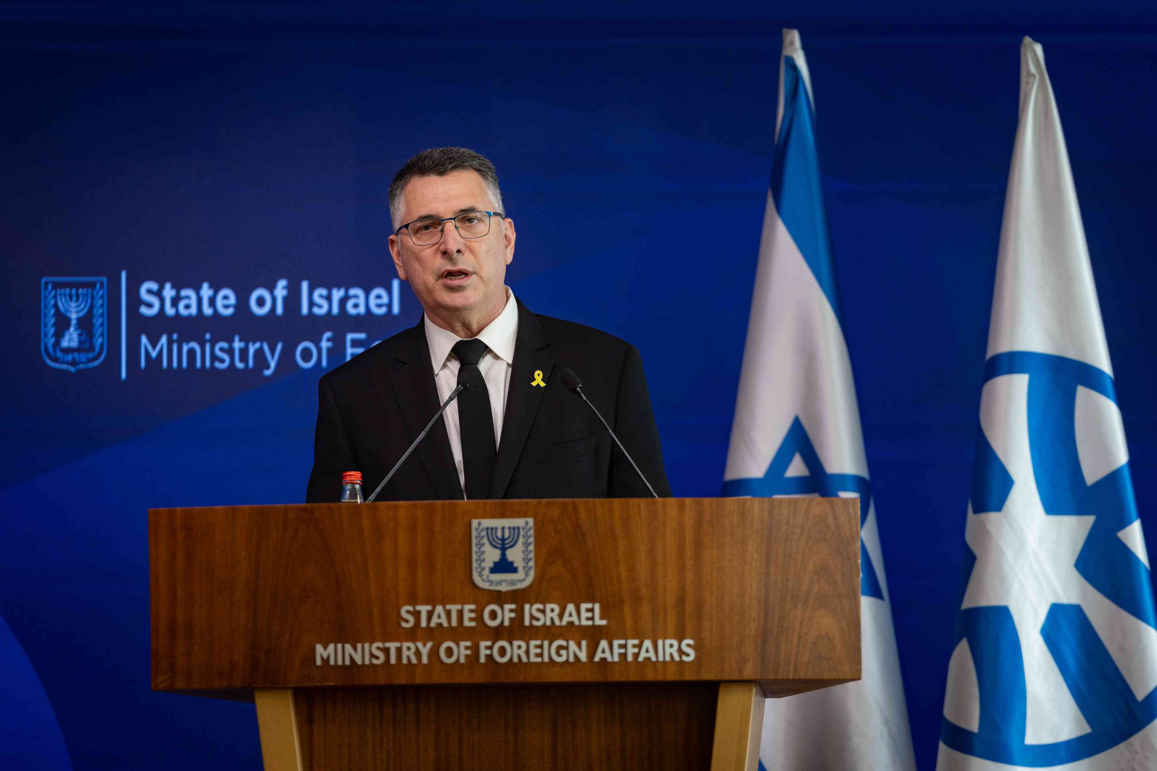 Foreign Minister Gideon Sa'ar. background