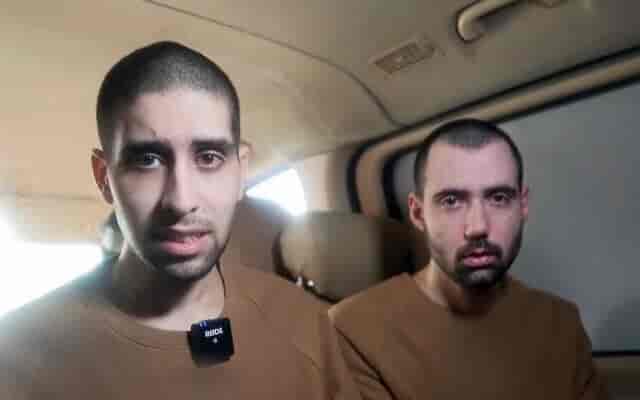 Hostages Evyatar David (left) and Guy Gilboa-Dalal speak in a Hamas propaganda video filmed at the site and time of the release ceremony in Gaza for three other captives, February 22, 2025 background