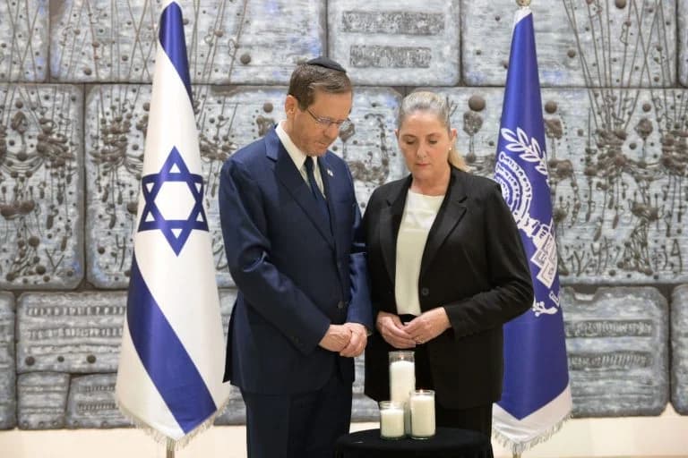 President Herzog and his wife Michal light a candle President Herzog and his wife Michal light a candle
