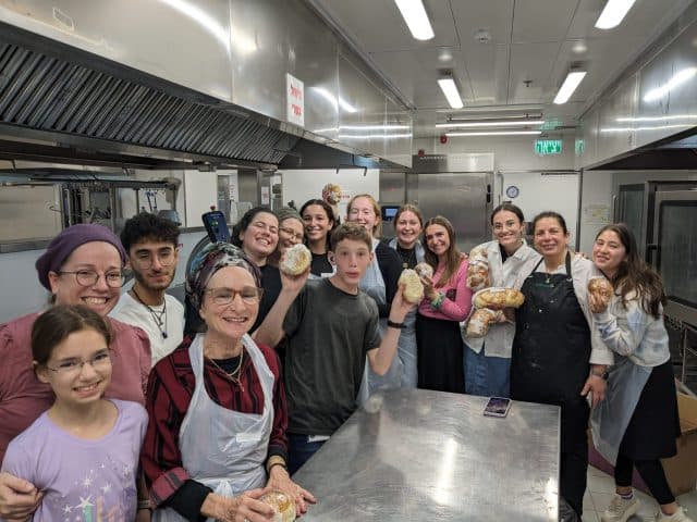 Rachel and her voluntary army of challah bakers. Rachel and her voluntary army of challah bakers.