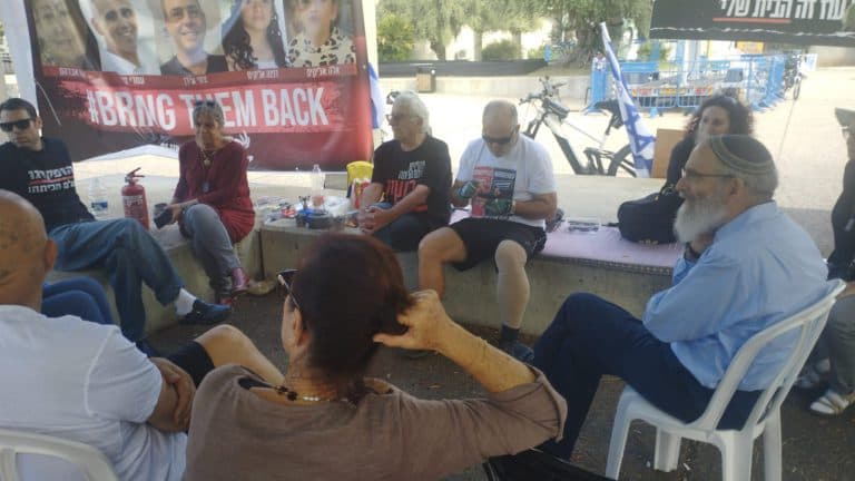 Rabbi David Stav visits captives' families in Tel Aviv encampment. Rabbi David Stav visits captives' families in Tel Aviv encampment.