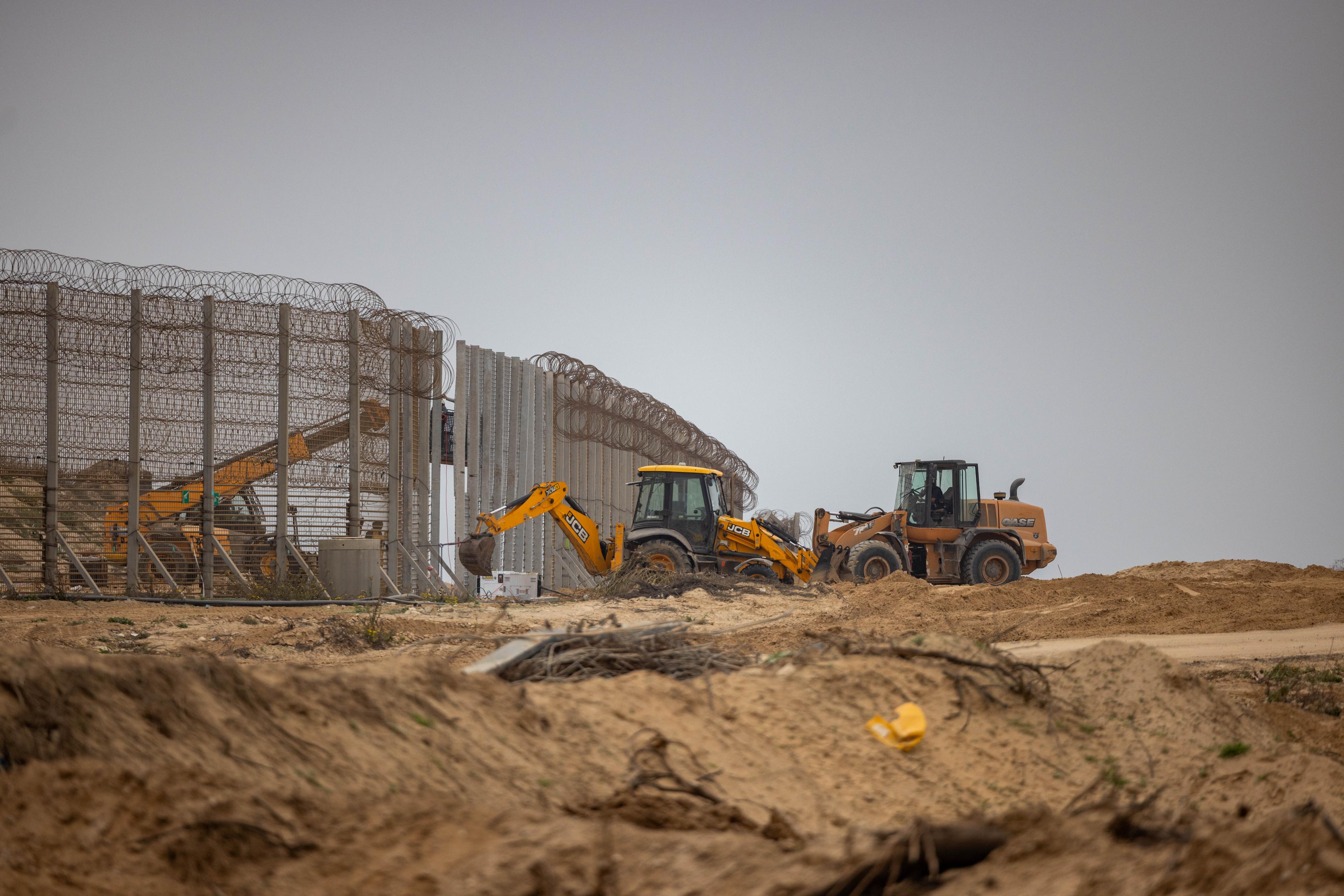 Tractors working on the border fence between Israel and the Gaza Strip, on December 28, 2023.