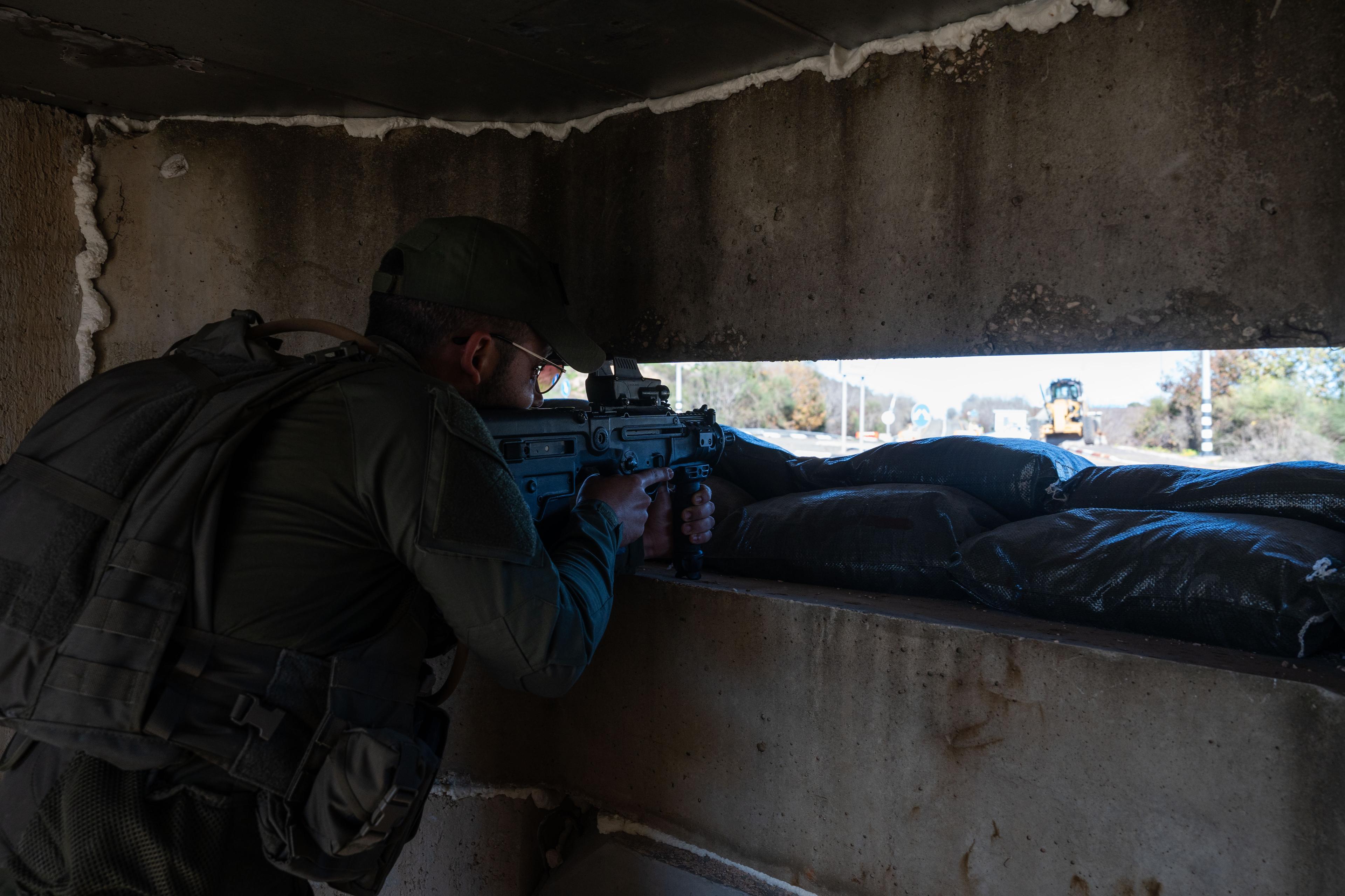 IDF soldiers guard at a temporary checkpointson a road in Northern Israel, near the border with Lebanon, January 6, 2024.