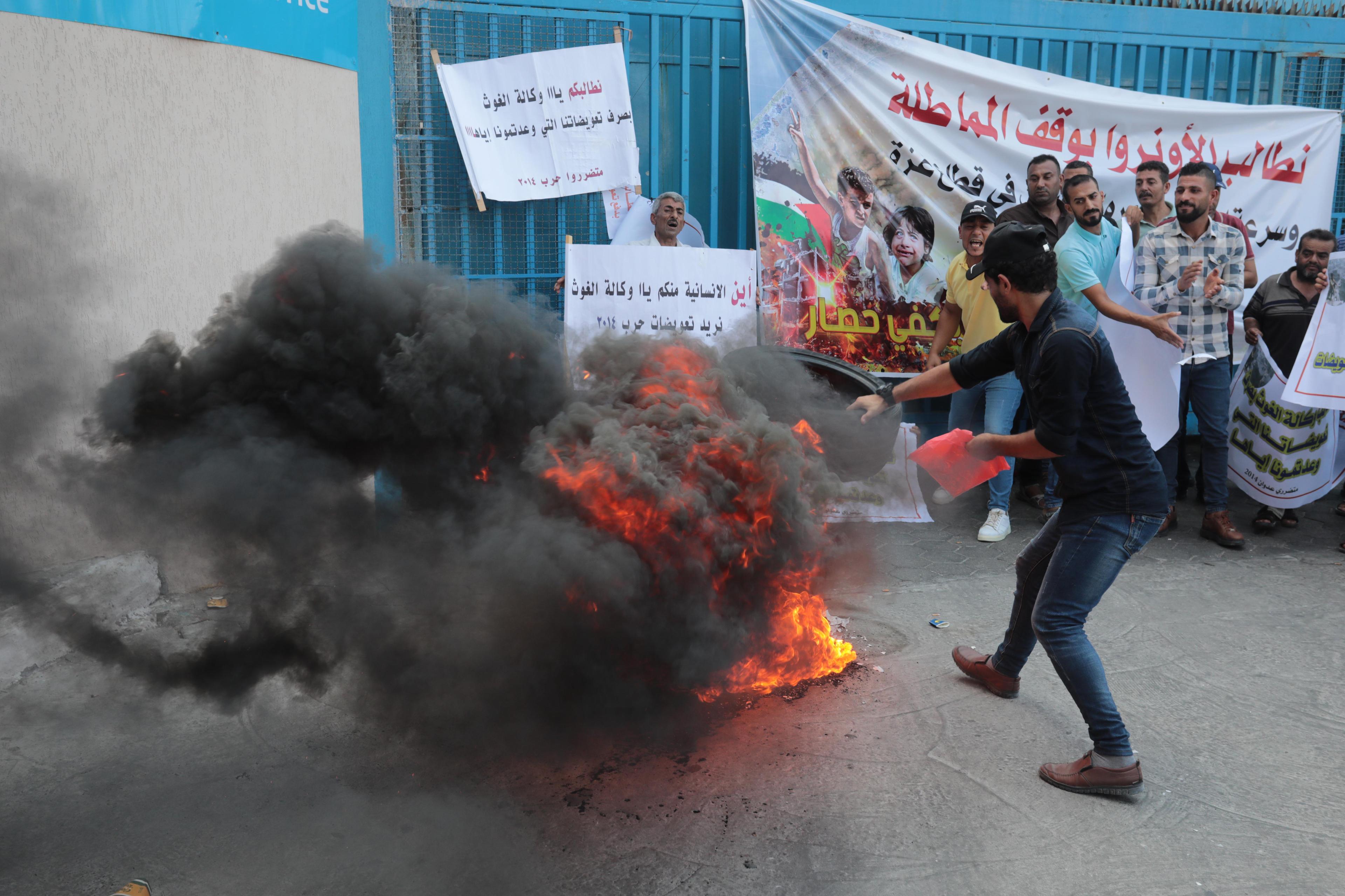 Palestinians protest demanding compensation for damaged homes in the 2014 war, outside the headquarters of "UNRWA", in Gaza City, on September 5, 2022. Palestinians protest demanding compensation for damaged homes in the 2014 war, outside the headquarters of "UNRWA", in Gaza City, on September 5, 2022.