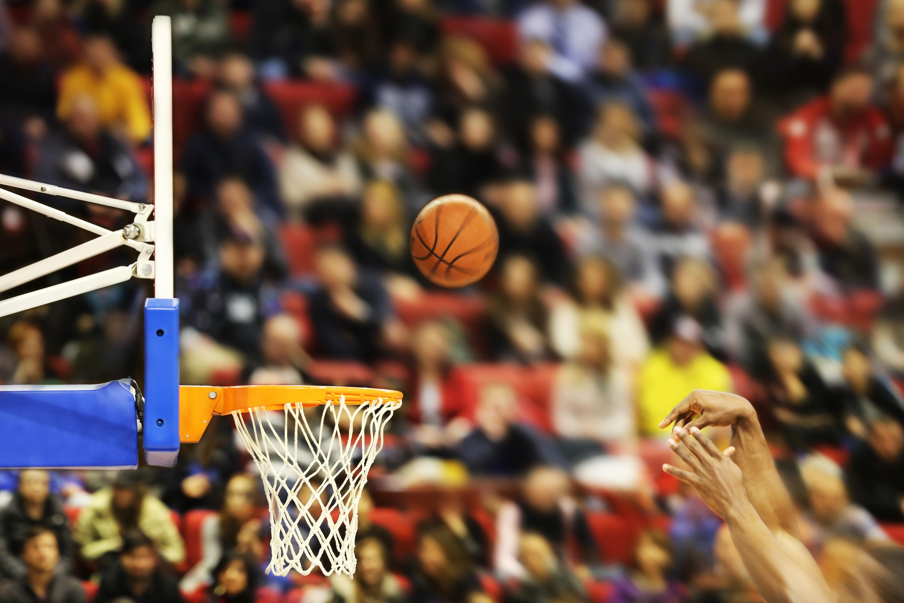 Scoring the winning points at a basketball game.