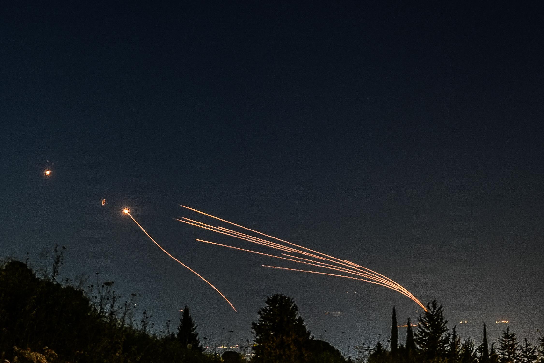 Iron dome anti-missile system fires interception missiles as rockets fired from Lebanon, as it seen over the Hula Valley, April 12, 2024. 