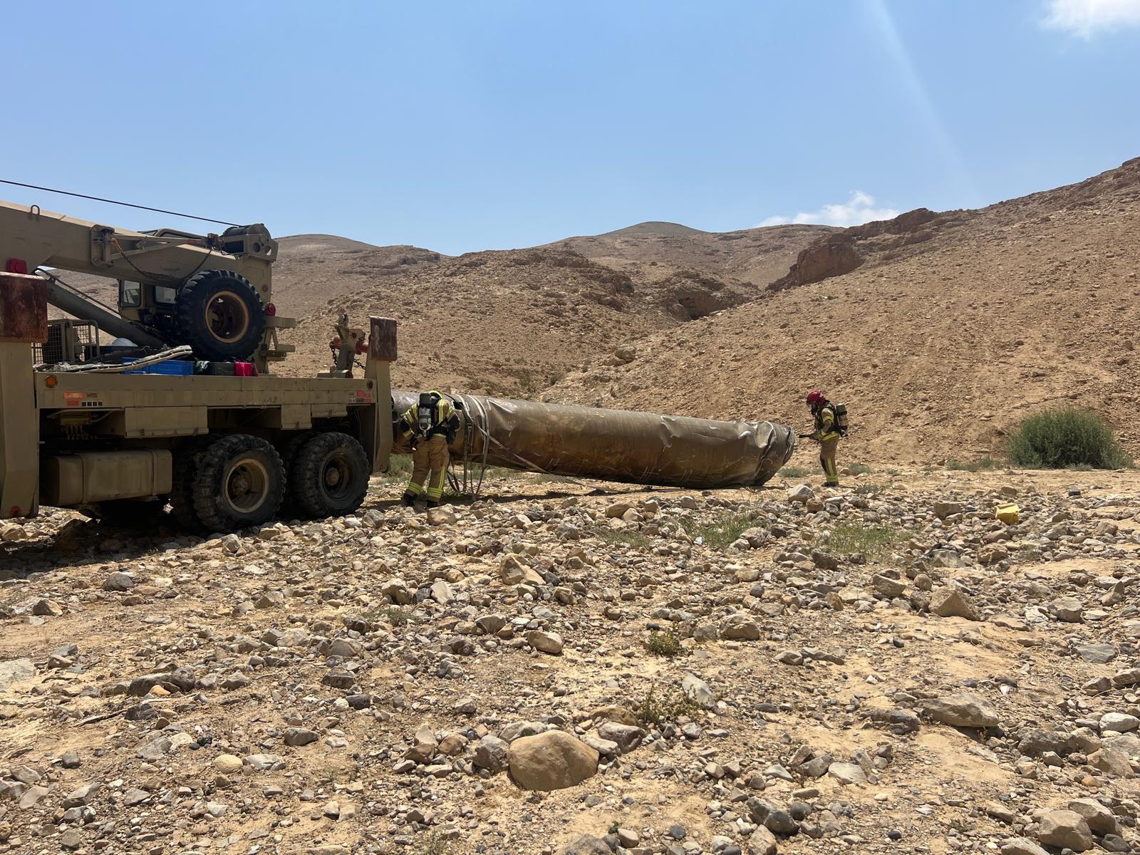 Preparing the intercepted missile for removal.