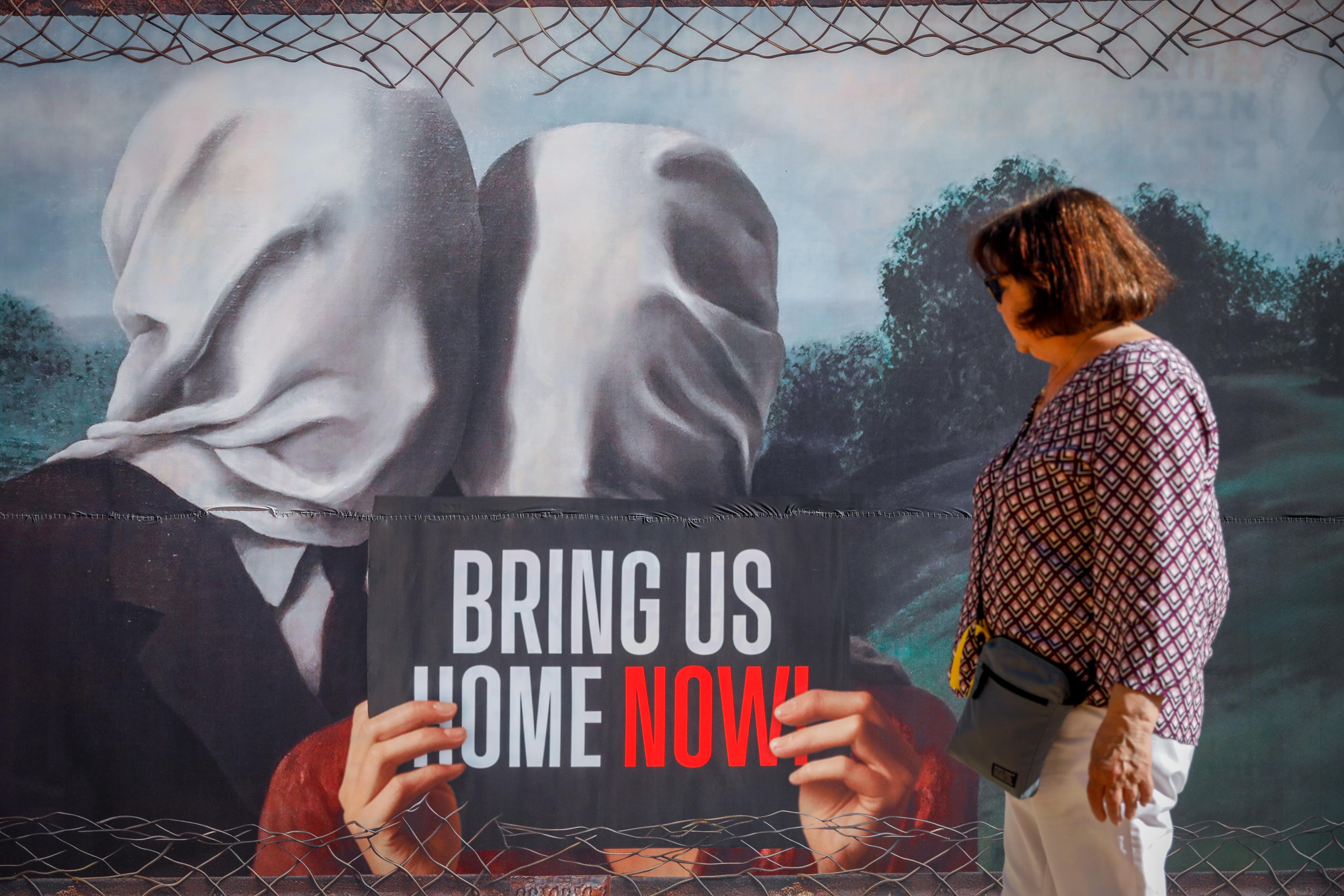 People walk at "Hostage Square" in Tel Aviv, May 7, 2024. 