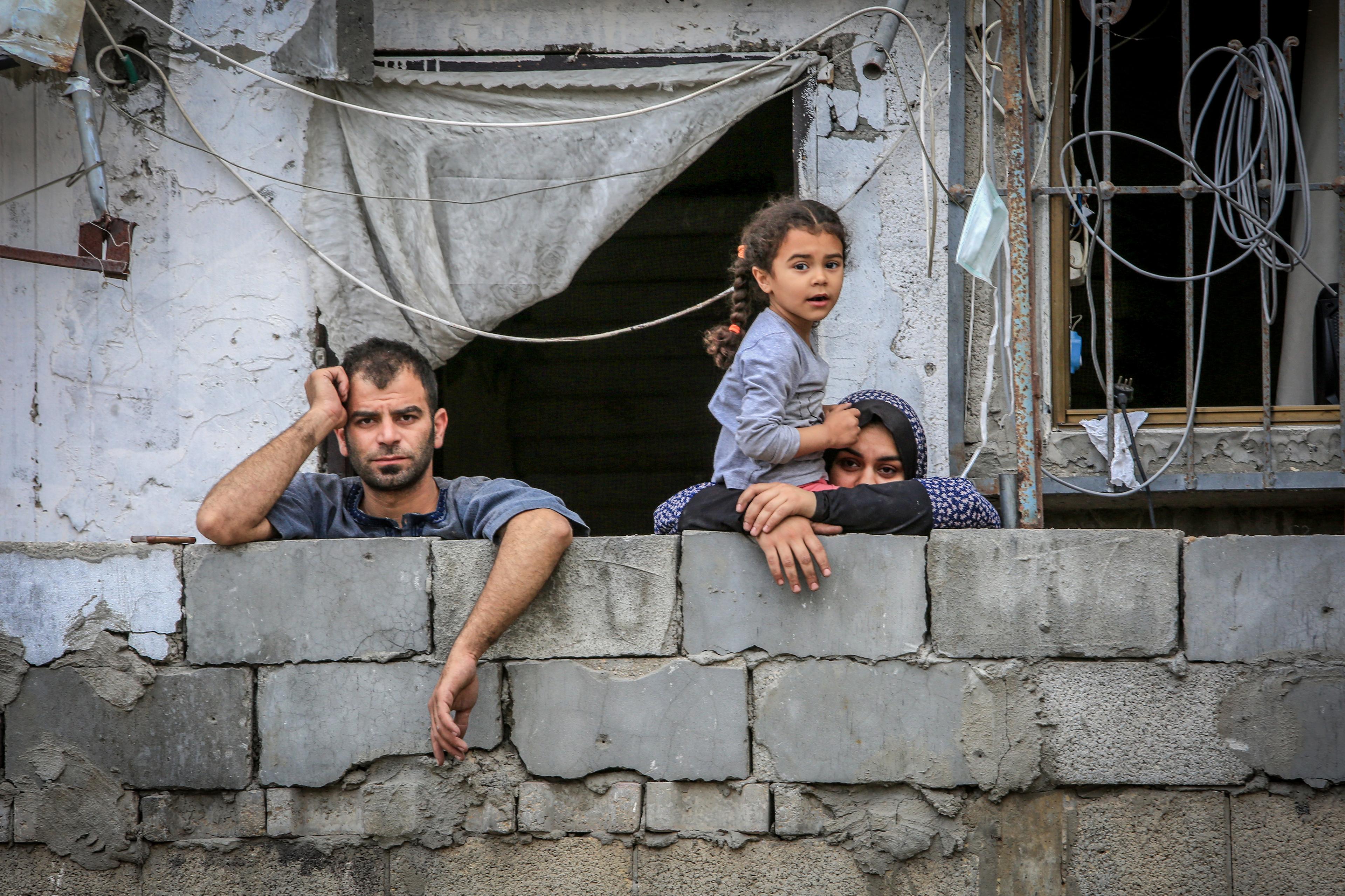 Palestinians inspect the massive destruction of the house belonging to the Al-Khatib family after it was destroyed in an Israeli air strike, in the city of Rafah, southern Gaza Strip, on April 29, 2024. 