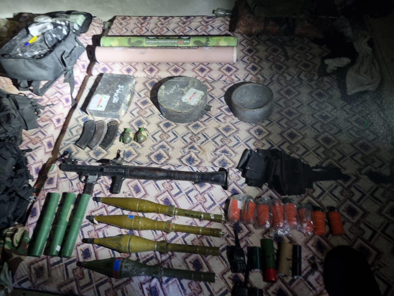 Weapons discovered in underground warehouse.