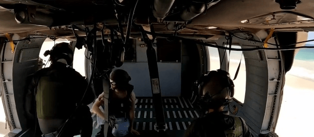 Hostage Noa Argamani (in jeans) getting on the helicopter taking her home.