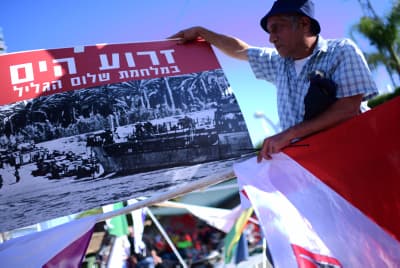 Israelis protest outside the Defense Ministry's Rehabilitation Division in Petah Tikva. Israelis protest outside the Defense Ministry's Rehabilitation Division in Petah Tikva.