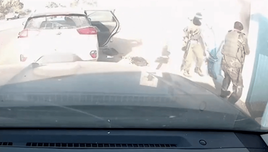 Hamas terrorists taking hostages on October 7.
